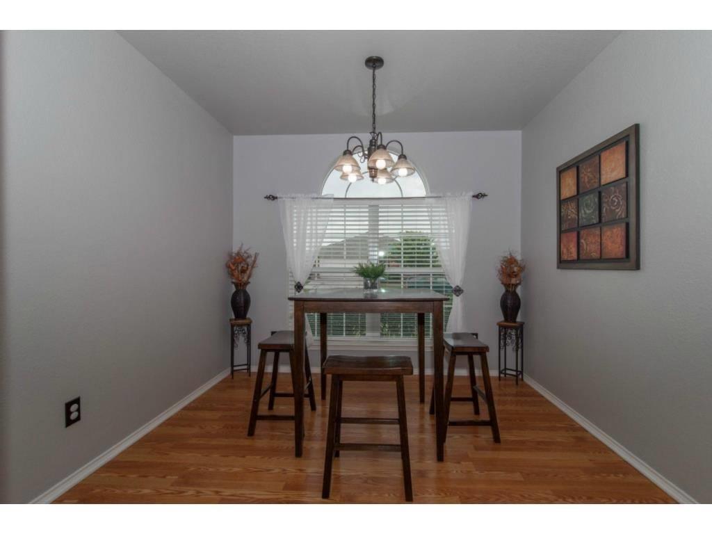 Very nice home with amazing open floor plan!!  Foyer has ceramic tile and the living area has laminate floors with a corner fireplace. Eat-in kitchen with breakfast bar. Master suite has garden tub and separate shower with walk-in closet. Backyard features covered patio and wooden privacy fence. Very close to shopping, dining and grocery.