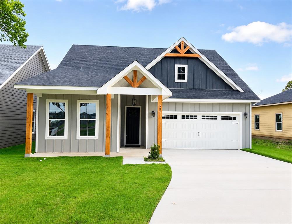 ***ASK ABOUT THE PAYMENT AFFORDABILITY PROGRAM AND SELLER INCENTIVES***Adorable cottage style home with a front porch designed for sitting! The attic window and decorative wood gables give the home a modern farmhouse vibe. The first thing you notice when you walk up to the front door is the added height that makes for a grand entrance. When you step inside you have a nice entryway space to add your special decorative touch, perfect for showing off your holiday best. The open concept living, dining and kitchen are at the back of the house, so you have privacy from front door guests. Since the home is new it has all of the energy efficient bells and whistles to help with that monthly electric bill. You can enjoy being comfortable during those hot Texas summer days, that seem to drag on for most of the year, but you won't notice the effect on your pocketbook and budget. The finishes are elegant and beautiful with durable stained concrete floors throughout the home, white cabinets, granite countertops, designer fixtures, and ceiling fans in the living room and all of the bedrooms, stainless steel appliances, island in the kitchen and an open concept floorplan with split bedroom arrangement. As a bonus, this home is within walking distance to the recently renovated Lee Pen Park and pool. Pool admission is FREE and includes lap lanes, an open swim area, a beach entry area with spray features, a lounge area, and a 15-foot water slide. Make this home yours for 2026!