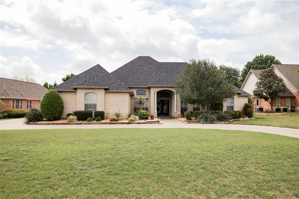 Beautiful Custom home, pet free child free, meticulous maintained.  Private and highly desirable Brookbend Grove area.  Truly custom home on over a half acre sitting on a cul de sac. Welcoming circle drive with muture low maintenance landscaping, tiled front porch with double front doors.  Home features plantation shutters, crown molding, ceiling fans throughout. Woods floors, transom windows and 12 foot ceilings in open concept living area.  Great room has custom built-ins and gas log fireplace with powder room conveniently located nearby.  Cooks kitchen features stainless steel appliances with double ovens, gas cooktop, custom cabinets, granite counters, island, large bar with walk in pantry. Opulent dining room with columns, transom windows, 12 ft ceiling.   Spacious breakfast nook with natural light. Large office with custom built-in desk and cabinets, French door.   Sunroom or flex room has tons of natural light, French doors overlooks pool.  Large primary bedroom with tray ceiling, ceiling fan, primary bath features dual vanities with beveled framed mirrors, jetted tub, separate shower,  private toilet room, large walk-in closet with built-ins.  Two large guest rooms with en-suite jack-n-Jill style bathroom, walk-in closet with built-ins in the front room, second bedroom has double closets. Both baths have beveled framed mirrors and plenty of storage.  Full size appliances set side by side in the laundry area with sink and cabinets. Double car garage with extra space for storage.   Backyard is a perfect entertainment area with a lovely pool, heated spa, large pergola, covered and tiled patio has speakers and wired for tv, bar area has a frig and storage area.  Mature landscaping and wrought iron fence.  Additional land behind pool area large enough for in-law suite or shop.  A must see property with nearby access  to I 35 and Hwy 287, located near historic Downtown Waxahachie and the north side expansion of shopping & restaurants.