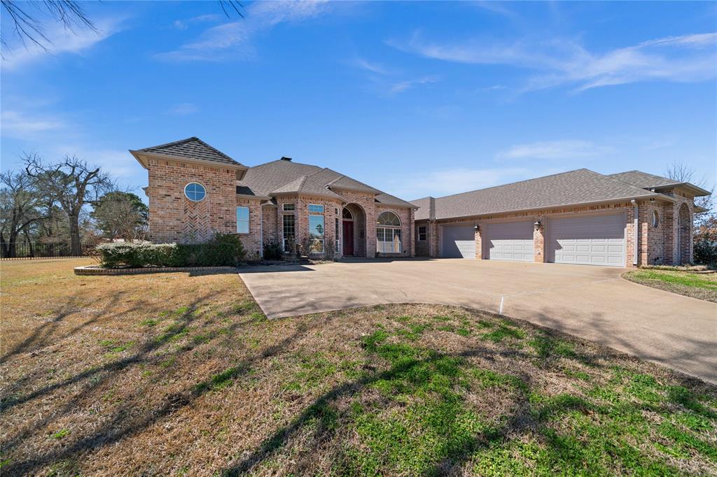DON'T MISS OUT ON THIS HOME THAT HAS IT ALL! 4 bedrooms, 3 bath, 3 car garage with a pool and shop on a beautiful 2.66 acre tract. This home stands apart offering an elevated comfort with a large lot, privacy, and optimized efficiency features, all while being close to town for easy access to necessities and entertainment. This home is located in the Woodcrest Subdivision offering nearly 3 acres of space for privacy and comfort. With 3,703 sq ft of living space, the home sits on one of the largest lot in the neighborhood and is just a mile from Hwy 79 for easy access to nearby towns. The home features a 3 car garage (925 sq ft) and a split level one-level floor plan. The master suite includes double door entry, his and her closets, a soaking tub and walk-in shower. Two of the bedrooms share a jack n jill bathroom while the 4th sits on the other side with it's own bathroom. This makes for a great mother in law area or guest suite. The kitchen is equipped with high-end appliances including double ovens. There are two living areas and an office. Outdoors, you will find an in-ground salt water pool. Two of the home's bathrooms are directly accessible from the pool, great for gatherings and kids! The spacious backyard leads to a 1600 square foot shop with two overhead doors, electricity, and water is accessible. Plenty of room for a workshop and storage.