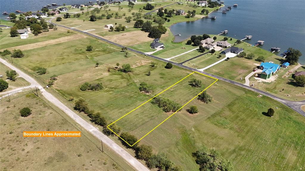 1.016 acres in the beautiful Southpoint subdivision on Richland Chambers Lake! This spacious lot gives you plenty of room to build the lake home you’ve always wanted in one of the most desirable gated communities on the lake. Southpoint is known for its gorgeous setting, peaceful atmosphere, and top-notch amenities that make lake living easy and enjoyable. The neighborhood offers everything you need for fun on the water and time with family and friends, including a community swimming pool, a covered pavilion for gatherings, and a private boat ramp for quick access to Richland Chambers Lake. Whether you enjoy boating, fishing, or just relaxing by the water, you’ll love having these amenities right at your fingertips. Because Southpoint is a gated subdivision, you’ll also enjoy the comfort of added security and a neighborhood that is well cared for. To help keep the community looking its best, Southpoint does have minimum building requirements: 1,600 square feet for a one-story home and 2,000 square feet for a two-story. These guidelines help maintain the value and beauty of the subdivision while giving you the flexibility to design a home that fits your style and needs. Richland Chambers Lake is the third-largest lake in Texas, offering some of the best fishing, boating, and recreation around. You’ll love the relaxing pace of life here, from sunrise views on the water to evenings spent cruising the lake. At the same time, you’re only a short drive from Corsicana, where you’ll find shopping, dining, and the small-town charm the area is known for. If you’ve been searching for the right lot to build your lake home, this 1.016-acre property in Southpoint has it all—space, amenities, privacy, and the perfect location on Richland Chambers Lake.