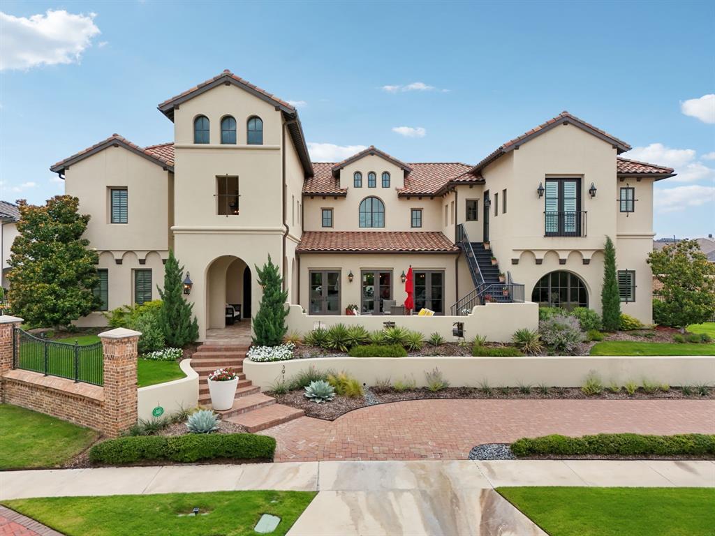 Offered for the first time since construction, this privately held Mediterranean estate is tucked behind the gates of Frisco’s prestigious Newman Village. A serene front courtyard welcomes you, framed by custom hand-crafted wood doors which set the tone for the home’s refined character. Inside, sculpted archways, streaming natural light, and rich hardwood floors create a graceful flow throughout. The kitchen was just renovated with Taj Mahal quartzite countertops and imported Italian tile backsplash, blending modern sophistication with everyday function. It also features Thermador Professional appliances, a built-in Miele espresso-coffee station, reverse osmosis water filtration, and a hidden catering kitchen. The primary suite is experiential in every sense. A $120,000 renovation introduced hand-applied Tadelakt plaster shower walls, floating white oak vanities, imported marble flooring, and ambient LED lighting, creating a spa-like bath sanctuary. The casita is fully connected to the main home but offers its own private entrance, ideal for extended family, guests, or flexible living arrangements. A dedicated office with hidden 2nd office area anchors your workday, while a media lounge, climate-controlled 200-bottle wine vault, and flexible bonus room invite relaxation and entertainment. The home is automated with an Elan system for lighting, entertainment, pool-spa, patio screens, security & cameras. The pool, designed and built by Pool Environments, features a heated and chilled pool and spa with in-floor cleaning system. The outdoor kitchen, gas fireplace, and motorized screens create year-round use of the oversized patio, while the property is surrounded 360 degrees by a custom mosquito misting system. The 11ft ceilings in the three-car garage includes a lift system option to accommodate up to four vehicles. Located just blocks from PGA, Fields development, this home offers, modern upgrades, lifestyle flexibility, without the $5M new construction price tag.