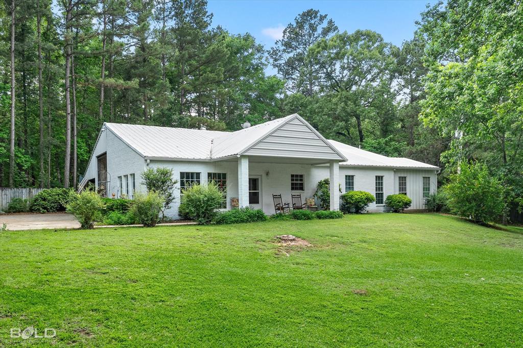 A snow bird's delight! Have you been searching for a home that can accomodate your RV? How about a home with a fully covered, insulated, 40 ft RV garage? Need more parking? Don't worry this house has you covered with an additional 2 car garage and 2 car carport. And did I forget to tell you about the ADDITIONAL, connected shop that has a single garage door? Oh ya, there's also that. A home of convenience and practicality, this home was built in 2000 and designed for the owner to be able to jump in their RV and head out at a moment's notice. A freshly painted brick exterior sets the backdrop for this gorgeous home that sits on 1.099 acres. As you come up the private entrance you'll be in awe of how it sits at the top of the hill. Before you can pull your RV in you'll notice all of the extra concrete that was poured to make sure not only your RV, but your personal vehicles as well have enough parking and turn around space. With 3 beds and 2 full bathrooms, the main house was constructed in the common style we saw in the early 2000's. Big open living room, cathedral ceilings, and a large kitchen that was open to it all. The primary bedroom is a very good size as are the other 2 guest bedrooms. The 3rd bedroom has it's own exterior door as it was originally designed as a tinkering room for the original owner. Additional features include newer paint throughout the inside, All new appliances, a 5 year old HVAC system, and a metal roof that you'll never have to worry about replacing. Enjoy the outdoor space as you have ample room to move around on this large lot. The covered, front porch invites you to sit and relax a while as you finish out your day. The rolling hills of Benton are quiet and tranquil in this area. Set far off a main road and right near the lake, you'll disappear into the natural landscape that this property provides. Call today to set up a private showing!