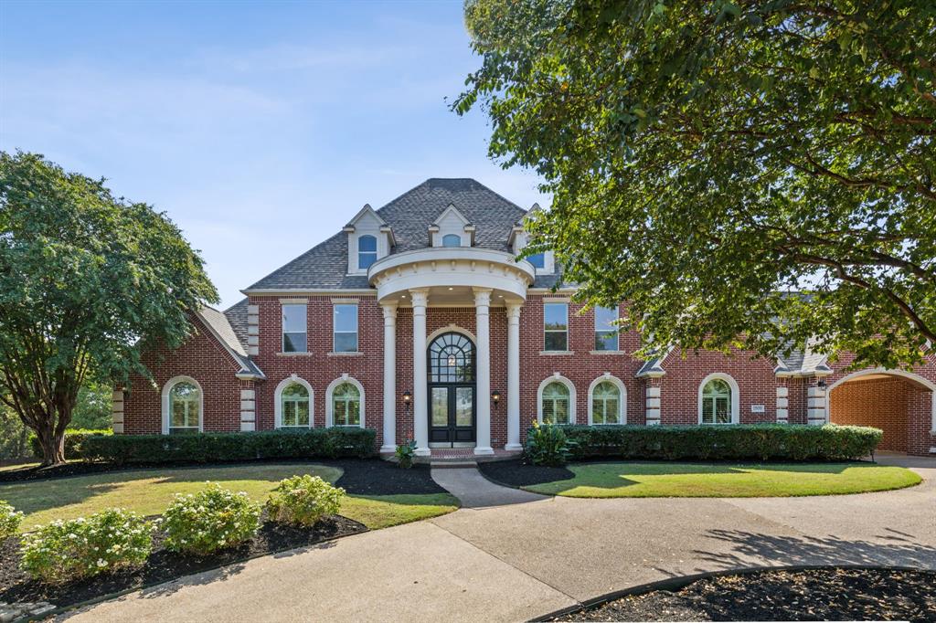 Welcome to an elegant Southlake retreat on a spacious 2.45-acre, gated lot in a tranquil cul-de-sac. Just minutes from Southlake Town Square and Carroll High, this 5-bed, 5.5-bath home features an open-concept design, with 2 bedrooms downstairs and 3 upstairs. The primary suite offers easy access to the backyard, along with a large bathroom featuring high ceilings and a walk-in closet. The chef’s kitchen boasts a large gas range, dual built-in refrigerators, and ample storage, while a nearby media room with a mounted screen enhances relaxation. Upstairs, enjoy a game room with a bar area and cozy fireplace. The office shines with a coffered ceiling and built-ins. Outside, a covered patio and private pool are complemented by a new irrigation system across multiple zones and the option for both well and city water. Fresh paint and new glass on windows complete this rare find.