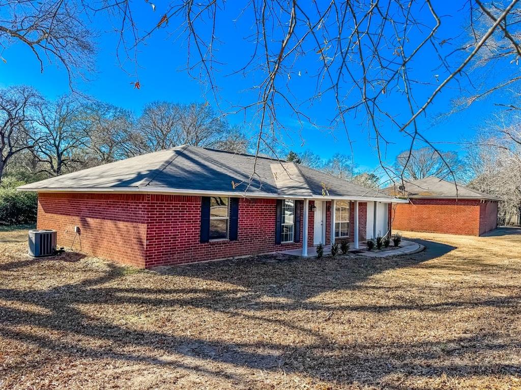 Charming brick home — 3 bed, 2 bath with a 1-car garage. Sits on a generous .83-acre lot with large shade trees and a spacious backyard perfect for play, entertaining, or gardening. Property includes a 20' x 11' storage building for tools and seasonal items. Located near Westwood Elementary. Ready for relaxed living in a peaceful neighborhood.