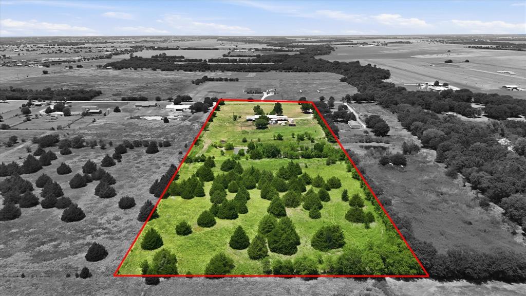 Opportunities like this don't come around often! Situated on 12.13 acres just south of Waxahachie, this versatile property offers endless possibilities with ample road frontage, a prime location in the Waxahachie ETJ, and no known deed restrictions. Whether you're dreaming of creating a family compound, building multiple homes, investing in future subdivision potential, operating a business that doesn't rely on highway visibility, or transforming the existing shop into an incredible barndominium, this property provides the flexibility to bring your vision to life.

The land features multiple potential building sites, is completely fenced for livestock or recreational use, and includes a pond near the center of the property. Utilities are already in place with a water meter through BVBUD, electric service, and an existing septic system. The improvements include a 50' x 80' insulated shop with approximately 14-foot sidewalls, roll up door and large walk through door, a 36' x 36' tall covered area on the east side, a 32' x 60' covered parking area on the west side, and an additional 20' x 20' covered section on the south that could easily be enclosed for additional workspace or storage area. Whether you need room for equipment, vehicles, a workshop, inventory storage, or a future residence, the possibilities are extensive. Currently in ag for low property taxes, no city taxes. Bring your imagination and create exactly what you've been looking for on one of the most versatile acreage properties available in the Waxahachie area with a convenient location to I-35E.