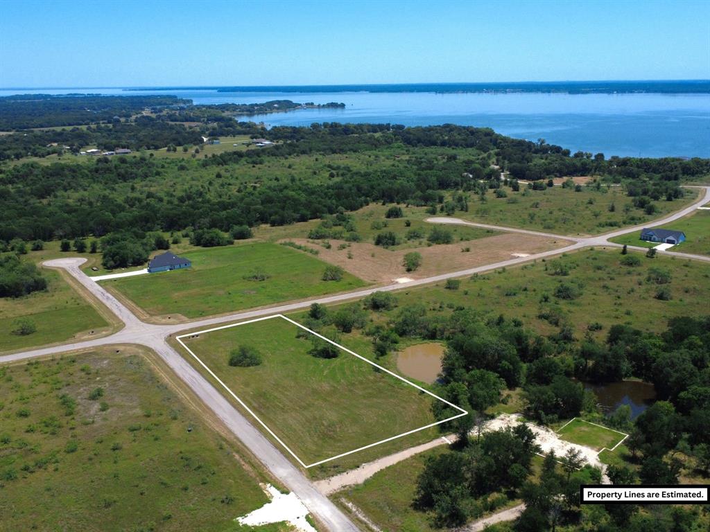 Experience the ultimate in lakeside living at Stillwater Shores on Richland Chambers Lake! Located just 60 minutes from Dallas, this rare 1.25-acre corner lot in Lot 29 is cleared and ready for your dream home in sought-after Mildred ISD. Nestled within an exclusive gated community, this property offers the perfect blend of privacy, recreation, and convenience.

Residents of Stillwater Shores enjoy premier amenities including a private lakeside pavilion, park area, outdoor cooking stations, firepit, sandy beach area, community fishing dock, private boat ramp, paved roads, and gated entrance. A nearby marina adds even more convenience for boating and lake adventures. Whether you’re searching for the ideal weekend retreat or your forever home, this spacious lot provides the perfect setting to embrace the lake lifestyle.

With no timeline to build and the freedom to choose your own builder, you can create the home that fits your vision. A minimum 1,400 sq. ft. building requirement ensures quality throughout the community. Imagine peaceful mornings near the water, unforgettable sunsets, fishing off the dock, and endless days enjoying all that lake life has to offer. Don’t miss this opportunity to secure your slice of paradise at Richland Chambers Lake!