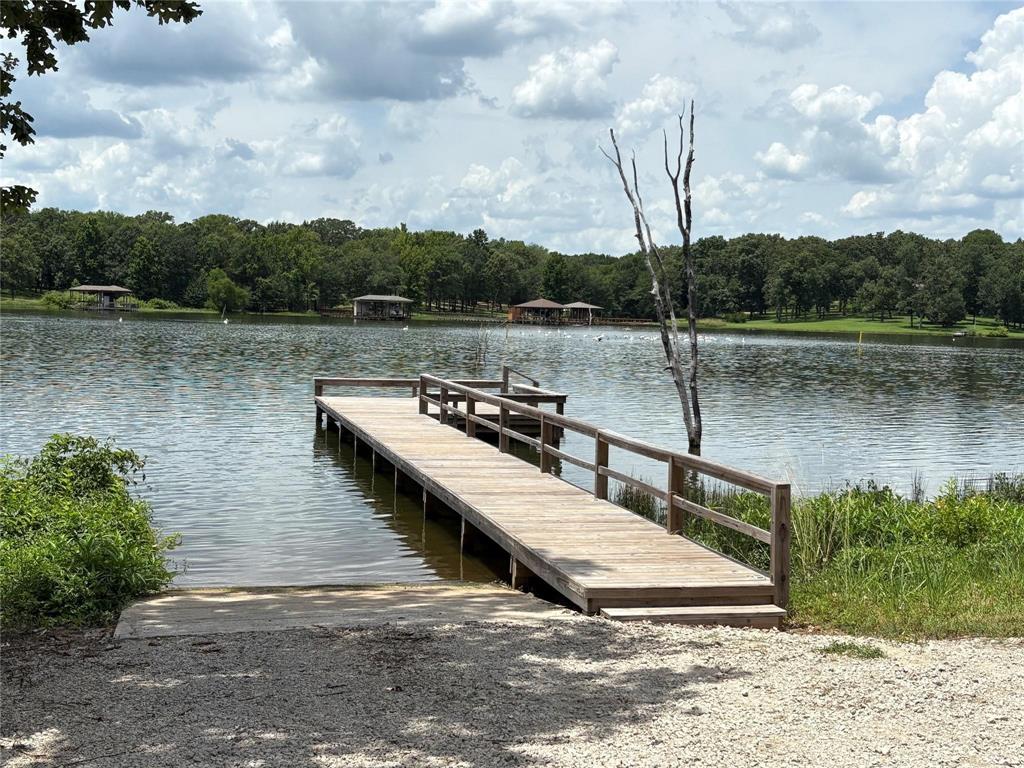Private Lake Fork access with boat ramp and fishing pier in this peaceful gated subdivision. Here is that large affordable lot you have been looking for to build your own custom home or weekend getaway. This is a FULL 1 acre lot on good sandy soil with plenty of space for a new home, a shop, a garden spot and room to enjoy. Heavenly acres offers living in a quiet subdivision with minimal traffic and quality East Texas lifestyle. Come out and check out this great community that is only a few miles from Yantis, Tx and centrally located between Greenville, Tyler and Sulphur Springs for easy commutes and only about 90 minutes from DFW. This is in the heart of Lake Fork Country.