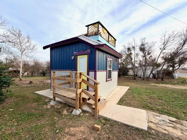 Calling all tiny home lovers and savvy investors! 
This adorable two-story tiny home proves that great things come in small packages. 
The smart layout features a loft style bedroom upstairs, while the downstairs offers a functional kitchen with refrigerator, a flexible living area with a pull up down table to maximize space, and a full bathroom complete with an oversized beautifully tiled shower. Proof that small spaces can still feel luxurious.
 Every square foot is thoughtfully designed for comfort, style, and efficiency. Sold fully furnished and styled to impress. Just bring your suitcase or your guests! An excellent short term rental opportunity located across from the high school, with a generously sized lot offering future expansion potential for additional tiny homes, RVs, or manufactured homes.
Whether you’re looking for a low maintenance short term rental, a unique Airbnb offering, or a property with room to expand, this tiny home delivers big returns in a small footprint. Opportunities like this don’t come along often. Perfect for investors ready to capitalize on the growing demand for unique, high yield rentals.