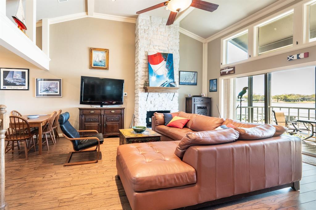 Experience lakefront living at its finest in the highly sought-after Rush Creek Yacht Club community on Lake Ray Hubbard. This rare opportunity offers a beautifully remodeled split-level townhome inside an exclusive waterfront community in the heart of Heath, Texas.
The upper level features an open-concept design with seamless flow between the living room, dining area, and kitchen — all perfectly positioned to capture breathtaking lake views. Step onto your private screened-in balcony off the main living space and enjoy peaceful mornings or stunning sunset evenings overlooking the water.
Downstairs, the spacious primary suite includes an ensuite bath, walk-in closet, and oversized sliding glass doors opening to a private patio with direct lake access. The second bedroom features built-in drawers for additional storage and functionality.
Owners in the community must become members of Rush Creek Yacht Club, where they will have access to the clubhouse, pool, docks, restaurant, bar, fire pit and the most amazing sunsets on the lake. Welcome home to 300 Rush Creek Drive, Unit B2. (Refrigerator, washer-dryer included)