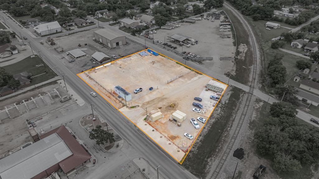 Positioned within the city limits of Stephenville this 1.384-acre tract offers a rare opportunity for industrial development in a highly accessible and growing area. Fully cleared and ready for immediate use, the property provides a blank canvas for a wide range of commercial or industrial applications. Zoned for industrial use, the lot is well-suited for warehousing, manufacturing, distribution, or equipment storage. A key highlight is its direct railroad access, adding significant logistical value for businesses that rely on efficient freight transport and shipping capabilities. A portion of the property is fully fencing offering both security and seclusion for operations, equipment, or inventory. With easy access to major roadways and close proximity to local infrastructure, this property combines convenience with functionality. Whether you’re expanding an existing operation or establishing a new industrial site, this strategically located acreage delivers the space, access, and zoning flexibility needed to support your vision.