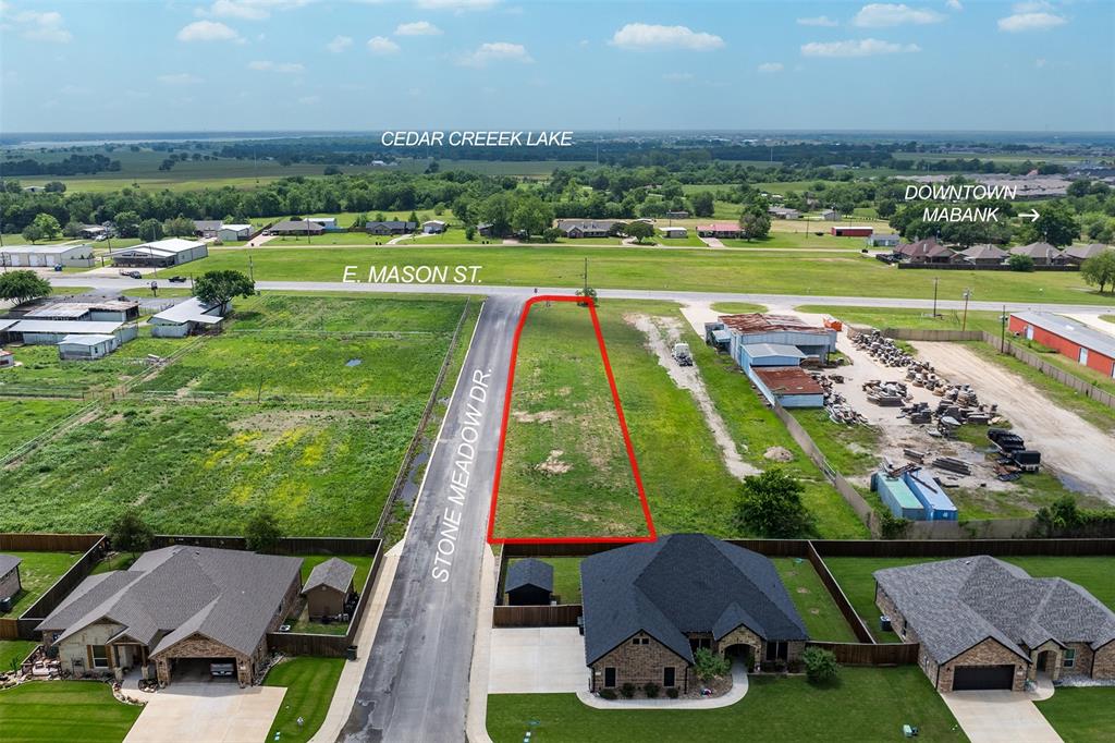 Prime commercial opportunity in the heart of Mabank! This high-visibility tract is ideally located at the corner of E. Mason St. and Stone Meadow Dr. The property benefits from steady traffic flow providing maximum exposure to both local and through traffic. Just minutes from Highway 175, this site offers quick and convenient access to a major thoroughfare connecting Mabank to the greater DFW area. Surrounded by established neighborhoods and ongoing residential growth, this site is well-positioned for retail, service, or investment use. Level terrain and great accessibility make it a ready-to-build location with outstanding exposure. Prime location near Cedar Creek Lake and downtown Mabank!