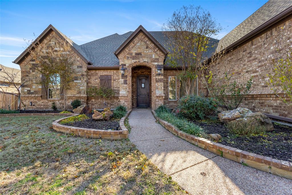 BACK ON MARKET! Welcome to a custom home that offers space, character, and room to enjoy both indoors and out. Custom built by Bailee Custom Homes, this 4-bedroom, 3-bath Spring Ranch home showcases timeless craftsmanship across 3,081 square feet on a 0.53-acre lot with a private pool and 3-car garage. The main living area features vaulted ceilings with exposed wood beams, true hardwood flooring, and a floor-to-ceiling stone fireplace, creating a warm and inviting atmosphere. Natural materials including wood, stone, and granite are used throughout the home, adding durability and classic appeal. The kitchen is designed with custom wood cabinetry, granite countertops, a large center island with seating, gas cooktop, double ovens, walk-in pantry, and ample storage, while two dining spaces provide flexibility for formal or casual meals. A dedicated media room offers additional living space, complemented by built-in storage cabinetry and an oversized laundry room with a utility sink, storage cabinets, and a separate storage closet. The primary suite features an oversized walk-in shower, soaking tub, dual vanities, and a large walk-in closet, with well-sized secondary bedrooms thoughtfully arranged. Outdoors, enjoy a private pool, large covered patio, and expansive backyard, offering plenty of usable space for relaxing or entertaining. Move-in ready and well maintained, this home is located in Spring Ranch and served by Northwest ISD.