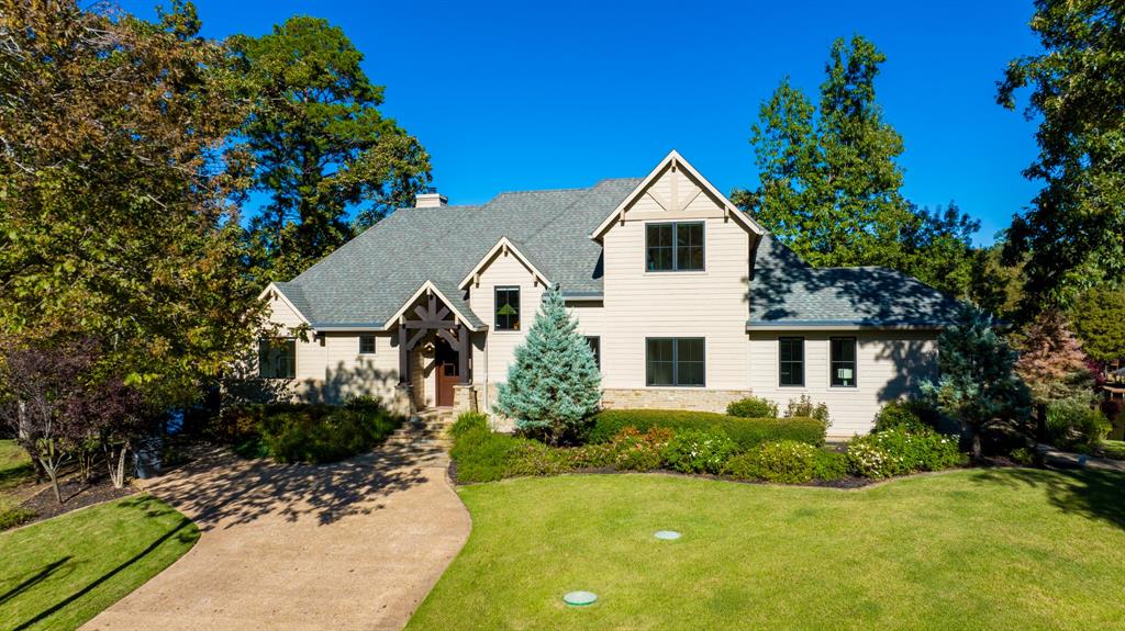 6 bedrooms, 5 baths, oversized 2-car garage and an exquisite bunkhouse, Lakesong is a premier property on Lake Cypress Springs. FULLY FURNISHED There's no other property like it! Elegance and comfort inside spill outdoors to
adventures on a 2021 Malibu Wakesetter 23 LSV, 2-2021 Sea Doo PW GTX LTD 300s, kayaks, water toys, and more! Modern technology such as the Control 4 system provides seamless management of music, lighting, and security cameras for the entire property. There's a water leak detection system throughout the property that communicates alerts instantly. Equipped with a 28-zone sprinkler system, the estate is spread over nearly 2 acres of luxuriously landscaped grounds and situated on 4 easterly facing lots in the exclusive Pine Valley subdivision. The architecture and design enhance the exquisite views from every room in the house, bunkhouse, and boathouse. An Italian bocce court, fire pits, a barbeque area and so more outdoors ensure endless entertainment possibilities.