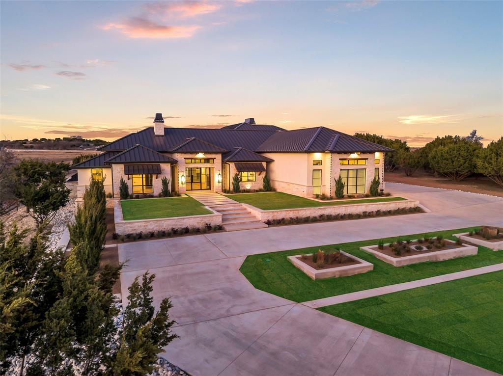 Welcome to 3117 Rio Grande Circle, an exceptional residence in the sought-after Putteet Hill Ranch, masterfully built by Blake Freeman Construction. This beautifully crafted home showcases high-end custom finishes, thoughtfully selected materials, and meticulous attention to detail throughout, creating a living space that is both elegant and inviting. Designed with both everyday comfort and seamless entertaining in mind, the spacious floor plan flows effortlessly to the outdoor living areas. Step outside to your private retreat featuring a stunning pool, private putting green, and multiple outdoor gathering spaces, perfect for relaxing evenings or hosting unforgettable gatherings. Car enthusiasts and hobbyists alike will appreciate the expansive four-car garage, offering ample space for vehicles, storage, and workspace. The primary suite is a true sanctuary, complete with a generous walk-in closet and the rare convenience of a dedicated laundry room within the suite, blending luxury with everyday practicality. Every element of this home reflects a commitment to quality craftsmanship, thoughtful design, and timeless style, making it a standout opportunity in one of the area’s most desirable communities.