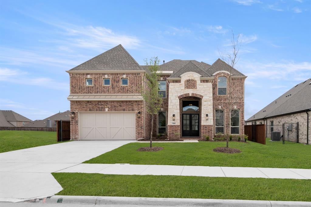 MLS# 21202389 - Built by First Texas Homes - Ready Now! ~ This stunning 5-bedroom, 4-bath home offers 3,470 sq ft of luxury living. The eye-catching peaked roof and grand arched stone entry welcome you through double front doors into a spacious, open-concept layout with wood floors throughout the main living area. The family room features a floor-to-ceiling upgraded tile surround at the linear electric fireplace and impressive 12' stacking sliding doors to the patio. The gourmet kitchen boasts upgraded counters, ceiling-height cabinets, and a stylish tile backsplash. An extra-large flex space on the first floor is perfect for entertaining or a playroom. The home also includes a 2-car garage. Don’t miss your chance to own this exceptional property—schedule your tour today!