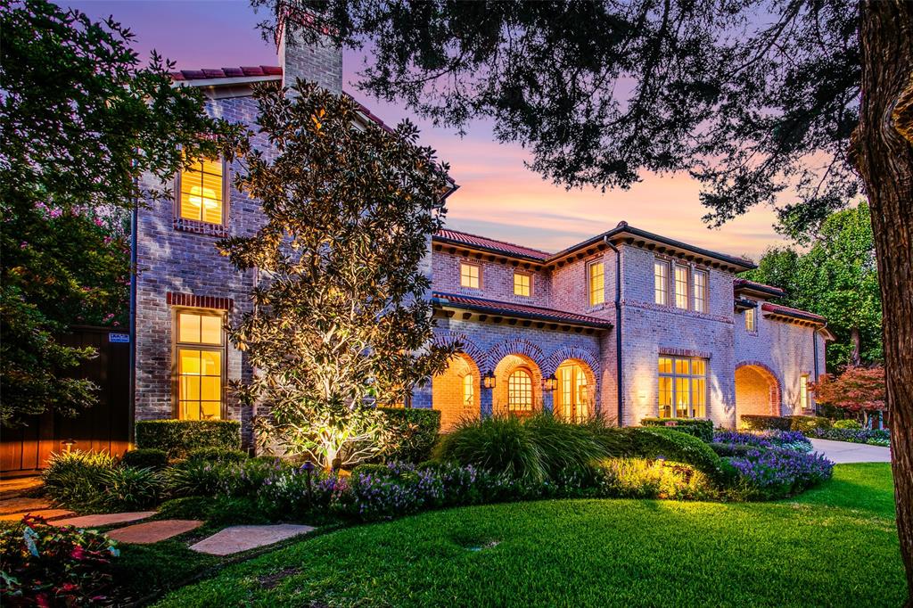 Exquisite Mediterranean-style residence with elegant arches, brick exterior, clay-tiled roofing, and lush landscaping on an oversized lot. The gourmet kitchen showcases custom wood cabinetry, Viking appliances, and separate wet bar leading to the dining room. The family room offers views of the pool, covered patio with fireplace, and beautifully manicured grounds. The first-floor primary suite has been recently updated and transformed into a true sanctuary, featuring an exquisite new spa-like bathroom and custom closet. One additional guest suite on the main level overlooks the pool, while another features a stone fireplace and can serve as an office or library. Second level has two additional bedroom suites, a game room, a recently added state-of-the-art cinema with a wine storage room, plus two attic spaces great for storage or conversion into a craft room or home gym. Attached two-car oversized garage, single stall detached garage, and porte-cochère provide abundant covered parking.