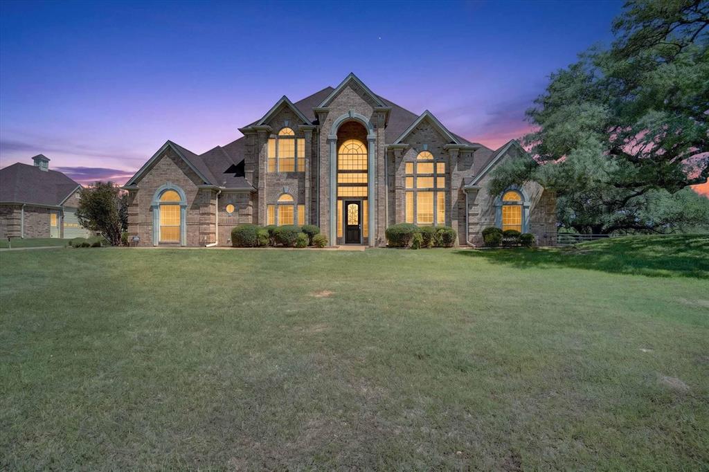 Welcome to your own custom equine property just minutes from Ft. Worth! Situated on just over 4 acres in the highly desirable gated community of Rollins Hills you will find an immaculate maintained home with a matching custom 2 stall horse barn that includes space for trailer parking or extra toys. The Property is fully fenced with pipe and no climb. There is plenty of lush grass and turn out for your horses to live their best lives. This home which features luxury living and equestrian style; features over 4100 ft. of living space with 5 large bedrooms, 2 of which are downstairs with your very own built in sauna! The expansive primary suite provides a peaceful escape with a spa like bathroom. There is room for family and friends to entertain with open loft area upstairs as well as a nice flowing kitchen to living room space. Outside, you have the community covered arena right next door! It's the best of both worlds to have your dream home and an indoor arena next door that is maintained within the community. There is so much to offer with this property that you must grab your favorite realtor and take a look!