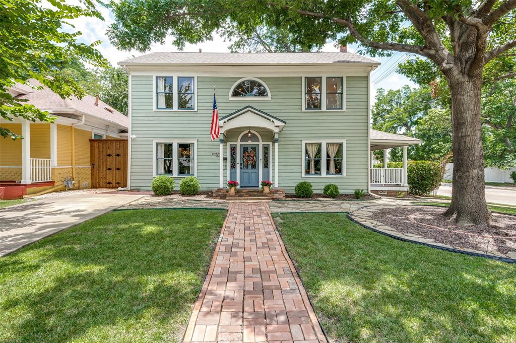Welcome to 5602 Reiger, a thoughtfully updated 1927 Craftsman in the heart of the Junius Heights Historic District, Dallas' first historic district & one of East Dallas' most beloved neighborhoods. Blending timeless architectural character with meaningful modern improvements, this 4-bedroom, 2.5 bath home features original hardwood floors, 9-foot ceilings, preserved historic details, a rebuilt side porch, private courtyard entertaining space, & a new roof replaced in 2025. A brick walkway & inviting front porch lead to a gracious entry foyer, where a central staircase elegantly separates the formal living & dining spaces. The living room showcases a gas fireplace, original leaded-glass windows overlooking the covered side porch, custom built-ins with a thoughtfully added wet bar, & French doors opening to a private courtyard with flagstone patio, wrought-iron gate, & landscaped green space. The renovated kitchen is designed for both everyday living & entertaining, featuring a 36-inch Bertazzoni range with pot filler, floating vent hood, Bosch dishwasher, farmhouse sink, built-in wine cooler, abundant custom cabinetry, marble countertops, & a charming breakfast area overlooking the backyard. Upstairs, the primary suite offers a walk-in closet & refined ensuite bath with Carrara marble finishes, dual vanities, & an oversized shower. Three additional bedrooms provide flexibility for family, guests, nursery, or dedicated office space. A second full bath showcases classic design elements, including a clawfoot tub with shower, & decorative tilework. Additional highlights include a first-floor powder bath, custom storage shed, foundation maintenance & structural improvements, & numerous recent updates throughout. Surrounded by tree-lined streets & preserved historic homes, Junius Heights offers a strong sense of community while placing you just minutes from Lakewood’s shops, restaurants, the Santa Fe Trail, downtown Dallas, & the recreational amenities of White Rock Lake.