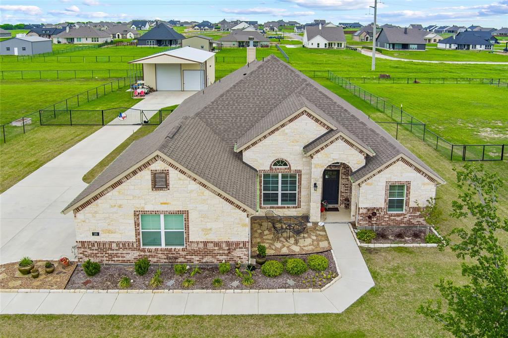 Stunning Modern Ranch-Style home in Rhome, Tx. Built in 2021 this home offers a 4 Bedroom, 3 Bath, Study with 3 CAR Garage.  Step inside and you'll immediately notice the expansive layout, ideal for entertaining and everyday comfort. The heart of the home flows seamlessly from the living area to the kitchen and dining space, creating a bright, inviting atmosphere. The Primary suite is a true retreat, highlighted by an oversized walk-in shower that brings a spa-like feel right into your home, Separate Vanities, Walk-In Closet and Luxurious Tub. Outside enjoy over half acre of fully fenced land, perfect for family gatherings, pets, or simply soaking in the wide-open Texas skies. This property is built for versatility, featuring an impressive, Covered RV or boat space with approximately 1200sf, 30x40 metal barn, 14ft. Door with Electrical R.V. pedestal. The neighborhood is a thoughtfully planned community blending spacious country living with modern convenience. Enjoy family friendly events, 4th of July parades, riding your golf cart through the neighborhood. Easy access to Highway 287 and Hwy 114