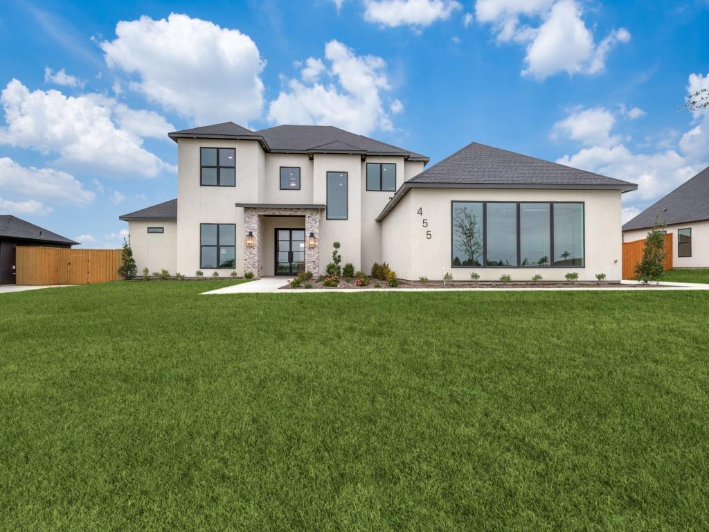 What is love? 

Hosting family and friends in your oversized kitchen for birthdays and holiday celebrations? 
Taking in spectacular sunset views from your covered patio as they transform into magnificent, starry nights? 
Luxuriating in your soaker tub after a long day at work?

However you define love, 455 Whispering Way offers it in droves. 

A lesson in subtle sophistication, this thoughtful, new construction beauty sits on three fourths of an acre. You become keenly aware of the home's wide, open spaces both inside and out from the moment you drive up. Soaring ceilings showcase the fireplace and catwalk when you step past the private study and into the great room. The kitchen, featuring a grand island with a workstation sink, a commercial range, a second oven, custom cabinetry, and an exceptionally large hidden pantry, is tailored for both those who need an everyday workhorse and for those who want a pretty space to entertain. 

With backyard access, a closet fit for those who enjoy the finer things, and a spa-like bathroom that screams, pamper yourself, the primary truly feels like a retreat. The first of three guest suites also sits on the first floor and is perfect for guests or multigenerational living. The downstairs half bath is also conveniently located in the guest wing. 

Upstairs, you’ll find a gameroom with the home’s second half bath along with a corridor off of an enclosed storage area that could easily double as a pocket library or children’s study. Two ample secondary bedrooms sit on the other side of the catwalk and feature a jack-and-jill bathroom with each room having its own sink. 

The home is as functional as it is beautiful, with real hardwood floors, spray foam insulation, a tankless water heater, and a board on board fence. It offers exceptional storage space with a 3 car garage, multiple storage closets, and walk-in closets in all guest suites. 

So schedule a showing and discover all there is to love about this home.