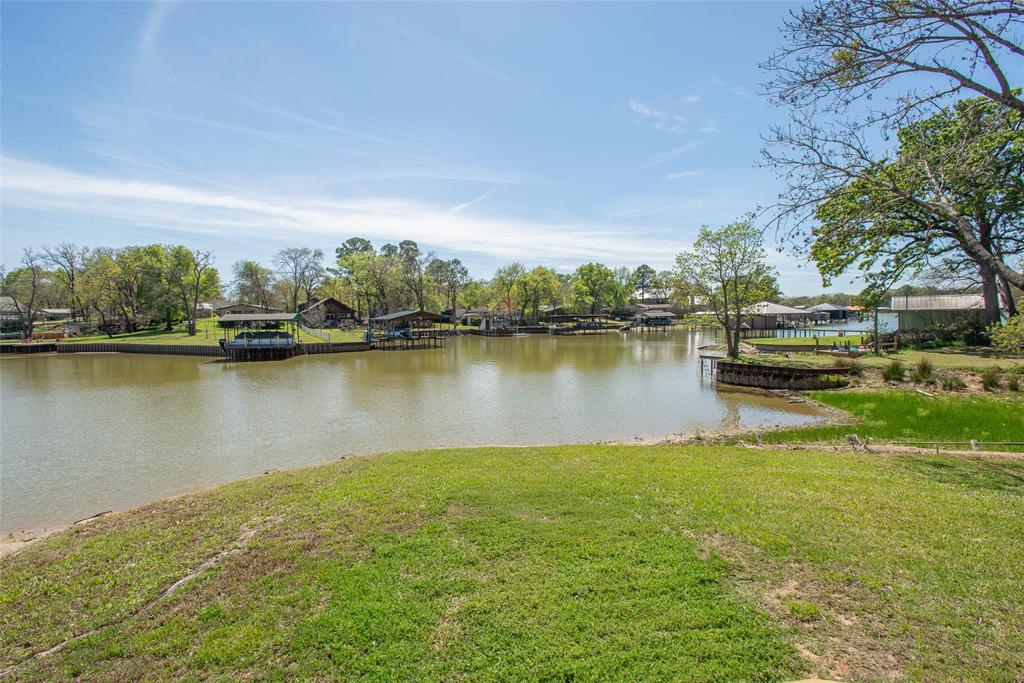 Cedar Creek Lake waterfront living at a new price. 117 Joy Lane in Gun Barrel City is now offered at $400,000, creating a strong opportunity for buyers searching for an updated lake home with beautiful views, comfortable space and a relaxed weekend ready feel. This 3 bedroom, 2 bath home offers approximately 1,630 square feet and is ideal as a full time residence, second home, or easy lake escape.
Inside, the enclosed sunroom is the heart of the home, offering peaceful lake views and the perfect spot for morning coffee, rainy day reading, or quiet evenings at the water’s edge. The updated kitchen brings fresh style and function, while the thoughtful improvements throughout the home make it easier to move in and start enjoying lake life right away. Recent updates include new flooring, cabinets, countertops, light fixtures, water heater, windows, exterior door, new exterior decks and more.
Step outside and enjoy the new decks, open sky, and waterfront setting. Whether you are grilling with friends, unwinding after a long week, or simply looking for a place where life can slow down a little, this home delivers the lake lifestyle buyers are searching for at Cedar Creek Lake. Select furnishings and appliances may convey with an acceptable offer, making this an even easier path to enjoying the lake from day one.
If you have been waiting for a Cedar Creek Lake waterfront home with updates, views and value, this is it. 117 Joy Lane deserves a closer look.
