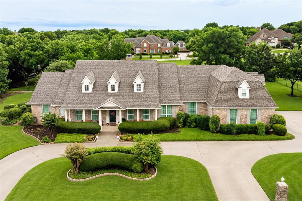Welcome to this exceptional one-owner custom home situated on a beautifully landscaped 1.22-acre lot. Offering 4,284 square feet of thoughtfully designed living space, this versatile floor plan provides the flexibility to accommodate virtually any lifestyle, from growing families to multigenerational living. Featuring 4 spacious bedrooms, 3.1 baths, a private office, and an oversized 3-car garage with an extra-wide single garage door, this home is packed with functionality and charm. Multiple living and entertaining spaces include a formal living room, family room, media room or second den, upstairs reading-homework retreat, and an expansive game room-providing five separate living areas to enjoy. The well-appointed kitchen is designed for both everyday living and entertaining, features 22-inch double ovens, ceramic glass cooktop, Bosch dishwasher, composite granite countertops, an oversized island, abundant cabinetry and drawers, and a filtered water system at the sink. Two dining areas offer flexibility for both formal gatherings and casual meals. A rare and highly desirable feature is the second primary suite, making this home ideal for multigenerational living, extended guests, or a private retreat. Attached to the garage is an air-conditioned 26'x12' workshop complete with a utility sink-perfect for hobbies, projects, storage, or a home workspace. Step outside to a beautiful covered deck just off the breakfast nook, overlooking the expansive backyard and stunning landscaping. The outdoor setting offers tranquility and plenty of room to enjoy and explore the acreage. Lovingly maintained by its original owner, this immaculate home showcases pride of ownership throughout. With so much space, flexibility, and unique features, this is truly a must-see property that offers endless possibilities.