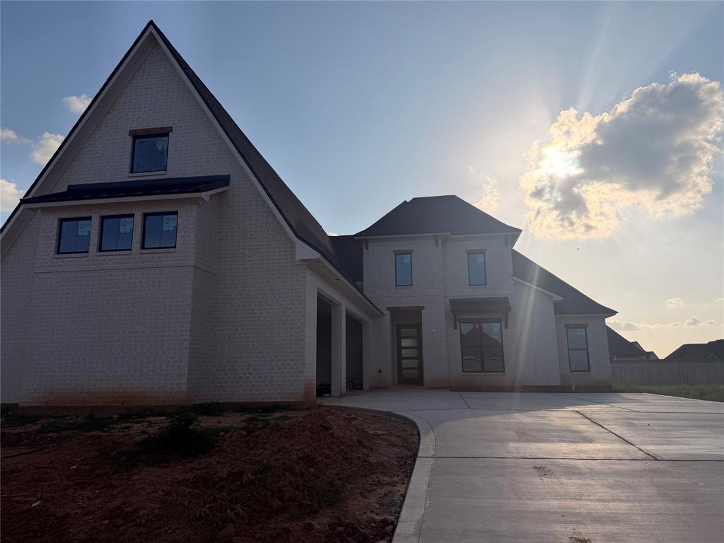 Showstopping new construction home available on a cul-de-sac lot in gated Canal Place. This stunning brick home is sure to impress as soon as you arrive - from the fresh and professional landscaping to the modern exterior details. The open and airy floorplan is perfect if you love to entertain - with each space flowing seamlessly into the next, abundant natural light, and high ceilings throughout. The living room features a cozy fireplace with custom built-ins, allowing you to showcase your personal design touches. The gourmet kitchen boasts stainless appliances, a large center island, sleek countertops, plus a huge pantry! The primary suite will be the perfect spot to relax after a long day with the luxurious ensuite bath complete with dual vanities, a fabulous soaking tub, and custom tiled shower. The additional 3 bedrooms ensure you have plenty of room for family or guests or even a dedicated home office. The 2 additional full baths allow for privacy and convenience as well. Upstairs, the media room serves as the perfect bonus space. Outside, the large back patio provides plenty of room for your grill and seating to enjoy time outdoors and the backyard offers room to roam allowing you the flexibility to install a pool, a firepit area, or maybe a playset. Conveniently located near North Bossier's shopping and dining, BAFB, and I220 for easy travel. Don't wait, schedule your private tour today!