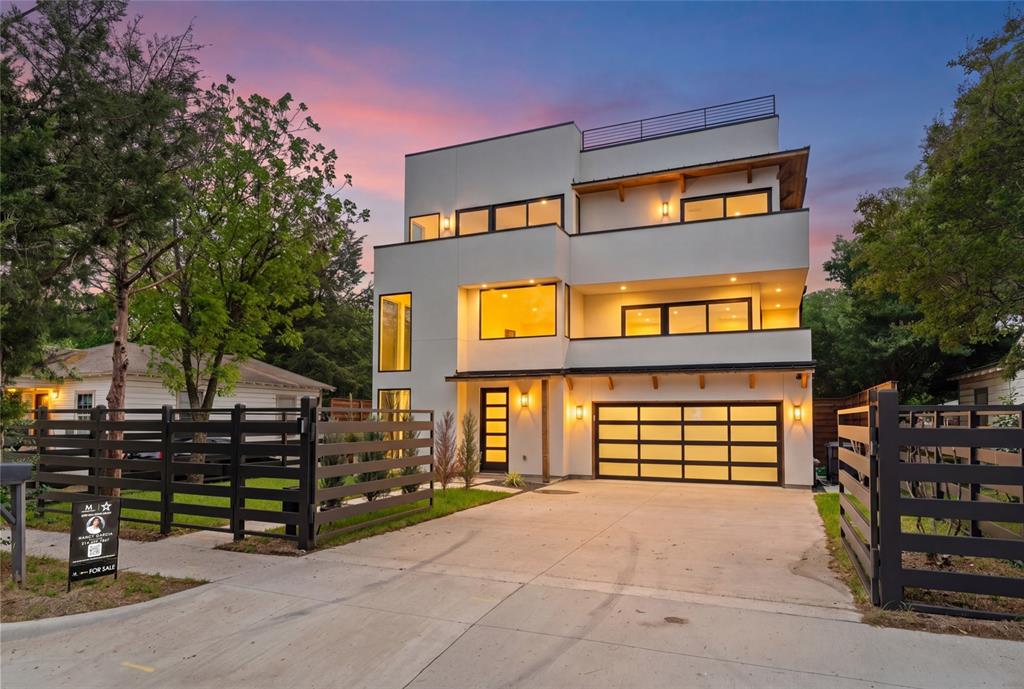 Welcome to this stunning new listing, a modern contemporary masterpiece that redefines elevated living in Dallas. Spanning three remarkable levels, this architecturally striking home delivers an experience that is equal parts sophisticated and functional. Step inside to discover soaring ceilings in the main living area, where natural light floods the space and sets the tone for the home's impeccable design. Two generous living areas provide the perfect balance for entertaining and everyday comfort.

The chef’s kitchen is a true showstopper, featuring a large center island, professional gas range, walk in pantry, and a seamless dining area ideal for gathering. Outfitted with premium KitchenAid and Whirlpool appliances, this space blends luxury with everyday functionality.

The primary suite offers a private retreat with breathtaking views, a wet bar with beverage fridge, and a spa inspired bathroom complete with a custom shower, soaking tub, dual vanity, and a spacious walk in closet with its own washer and dryer. In addition, the home features two sets of washer and dryer connections, conveniently located upstairs and downstairs.

Built with foam insulation throughout the entire home, this property is designed with comfort and energy efficiency in mind.

The crown jewel is the spectacular rooftop terrace, designed for entertaining with a built in outdoor kitchen, grill, and sink, perfect for sunset evenings under the Texas sky, all complemented by stunning skyline views of Dallas.

Every detail of this home reflects quality craftsmanship and premium finishes, including a custom built electric gate for added privacy and convenience. Located just minutes from Trammell Crow Park and the vibrant energy of Dallas, this home offers a lifestyle where luxury meets convenience.
3 Levels of Modern Contemporary Luxury
Schedule your private tour today.