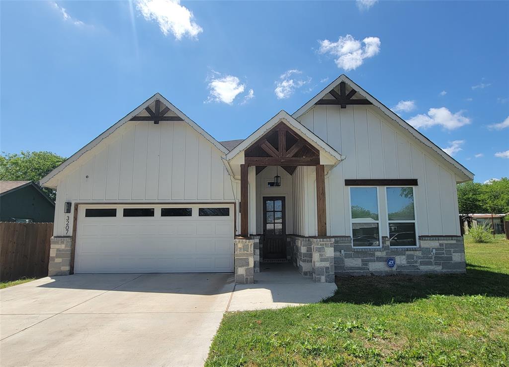 The exterior of this gorgeous home offers a welcoming presence in the neighborhood with its manicured front yard that enhances its curb appeal.  The front porch, highlighted by a rich wood-finished ceiling has an inviting first impression and gives the home a warm, refined character that draws you in from the moment you arrive. This traditional home, with architecturally accented ceilings features four bedrooms & two baths designed with a thoughtful split-bedroom layout for added privacy. Walk into a light-filled entry that opens to a gorgeous living-dining area that showcases an inset electric fireplace, surrounded by a cathedral-style ceiling highlighted by a chandelier that completes the warm, refined atmosphere. The primary suite includes a spacious walk-in closet with built-in shoe-rack shelving, and an elegant primary bath equipped with double vanities and a tiled shower.

This kitchen is a statement of style, comfort, and intentional design as the true heart of the home, blending luxury, function, and architectural creativity. Sleek quartz countertops complemented by kitchen island that draws family and guests together. Its open flow to the dining and living areas creates a seamless, connected environment perfect for everyday living and effortless entertaining. The walk-in pantry offers additional storage, while the uniquely designed built in wine rack & cozy space beneath provides an additional prep zone.  Every detail has been elevated with modern conveniences, from high-end appliances to smart functionality. Thoughtfully curated lighting design enhances both ambiance and performance, while the beautiful custom woodwork adds warmth and craftsmanship with contemporary aesthetics. The home features a nice-sized backyard, offering the perfect setting for family gatherings, weekend cookouts, and outdoor relaxation. Whether hosting friends or enjoying quiet evenings under the sky, this outdoor area provides the room and versatility every household appreciates.