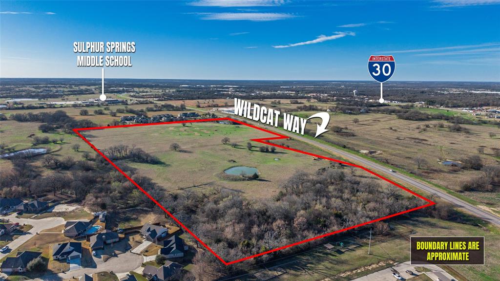 Expansive opportunities await on this impressive 45.402-acre tract located on newly established Wildcat Way in growing Sulphur Springs. Positioned in a high-growth corridor with close proximity to Interstate 30 and strong traffic counts, this property is ideally situated between two apartment complexes and an established housing development, making it a prime candidate for future development.

Currently Ag-exempt with cattle grazing in place, the land features two ponds and barbed-wire perimeter fencing. With surrounding expansion and infrastructure already underway, this tract offers exceptional future potential for residential, multi-family, or investment opportunities.

Buyer and or Buyer’s agent to verify all information and confirm intended or future use and any restrictions with the City of Sulphur Springs.