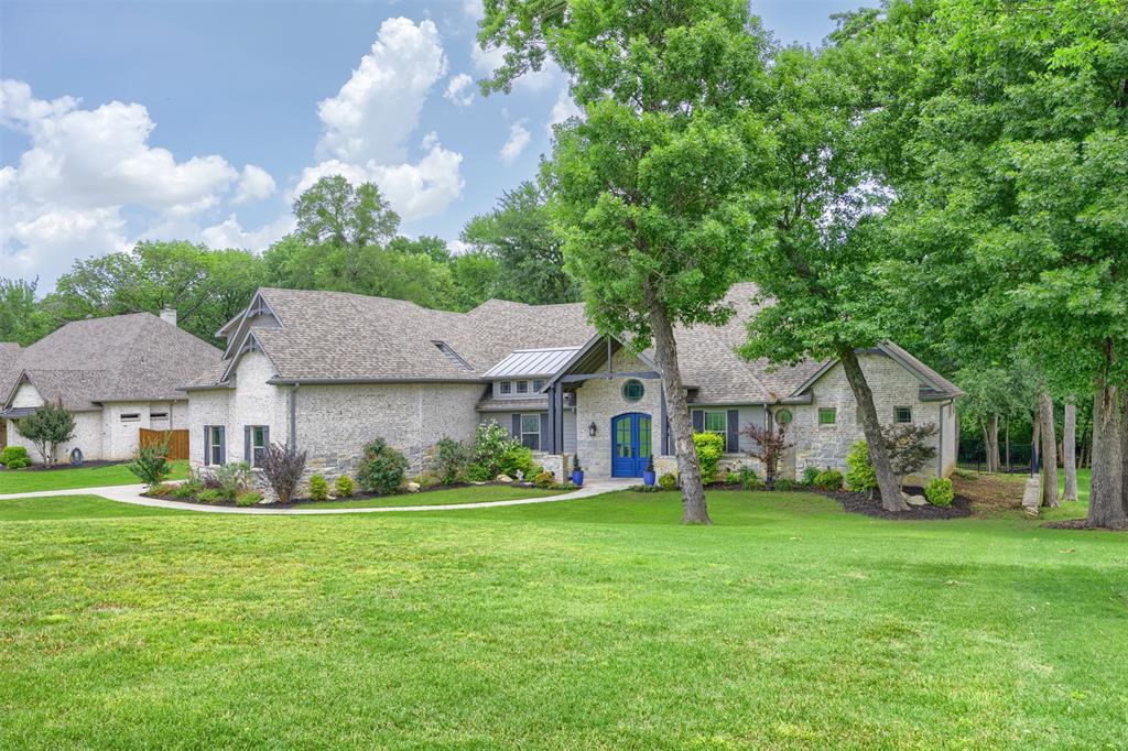 Gorgeous custom one-owner home situated on a private 1-acre lot in the highly sought-after gated community of Waterstone Estates. With 4 bedrooms, 3 full baths, a media room, flex space, and 3-car garage, this 3,800 sq ft home offers the perfect blend of luxury, comfort, and everyday function.

Beautiful double doors welcome you inside to an open-concept layout filled with natural light, large windows, and generous storage throughout. The oversized living and kitchen area is ideal for entertaining, featuring a built-in aquarium with live coral and tropical fish that creates a peaceful focal point in the living room. The spacious kitchen includes a Texas-sized island, stainless steel appliances, gas cooktop, walk-in pantry, and plenty of room to gather.

A convenient side entry leads into a functional mud room area with space for a second refrigerator, plus a coffee bar and wine fridge, adding even more everyday convenience and storage.

The oversized primary suite overlooks the serene backyard and features a spa-like ensuite bath with dual vanities, a Hollywood soaking tub, large walk-in shower, and stunning light fixtures. The custom primary closet includes built-in shelving and dressers and connects to a small workstation area and the laundry room, complete with a sink, abundant cabinetry, and extra storage.

Downstairs also includes an additional bedroom, full bath, and media room with stadium seating. Media furniture and equipment will convey with the home. Upstairs, you’ll find two large bedrooms, a full bath, and a flexible bonus space that could be used for storage, office space, or an additional bedroom.

The fully screened-in back patio offers plenty of room for relaxing or entertaining while overlooking the beautiful treed lot. With mature trees, privacy, and more than enough room for a pool, this Waterstone Estates property is a rare find.