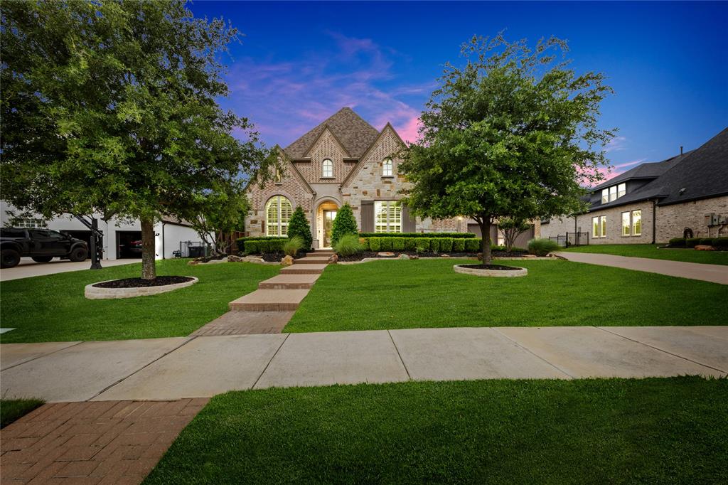 Situated on a rare .63-acre, east-facing lot, this meticulously maintained residence delivers a level of quality, scale, and refinement that’s increasingly difficult to find in Prosper. From the moment you enter, you’re greeted by dramatic soaring ceilings and walls of natural light, setting the tone for a home that feels both grand and inviting.

Every inch reflects intentional design and elevated craftsmanship—rich custom wood flooring, bespoke cabinetry, designer window treatments, and intricate finish-out details that create a cohesive, upscale aesthetic throughout.

The kitchen and family room serve as the heart of the home, offering a seamless blend of luxury and livability—perfectly suited for both intimate evenings and large-scale entertaining. A highly sought-after first-floor media room adds versatility and convenience, providing an ideal space for hosting or relaxing without compromise.

The primary suite is a true retreat, generously sized to accommodate king-scale furnishings, paired with a spa-inspired bath featuring a freestanding soaking tub and an oversized walk-in shower designed for a luxury experience.

Upstairs, a private balcony overlooks the lush greenbelt and expansive backyard, offering a peaceful vantage point rarely found in homes of this caliber.

The outdoor living is where this property truly distinguishes itself—resort-style pool, outdoor grilling station, and an expansive yard that provides both privacy and endless possibilities for recreation or entertaining on a grand scale.

Completing the home is a 4-car garage, delivering both functionality and flexibility for collectors or multi-vehicle households.

Zoned to Prosper ISD and the highly desirable Walnut Grove High School, this home combines estate-sized land, impeccable condition, premium orientation, and elevated design—all in one exceptional offering.