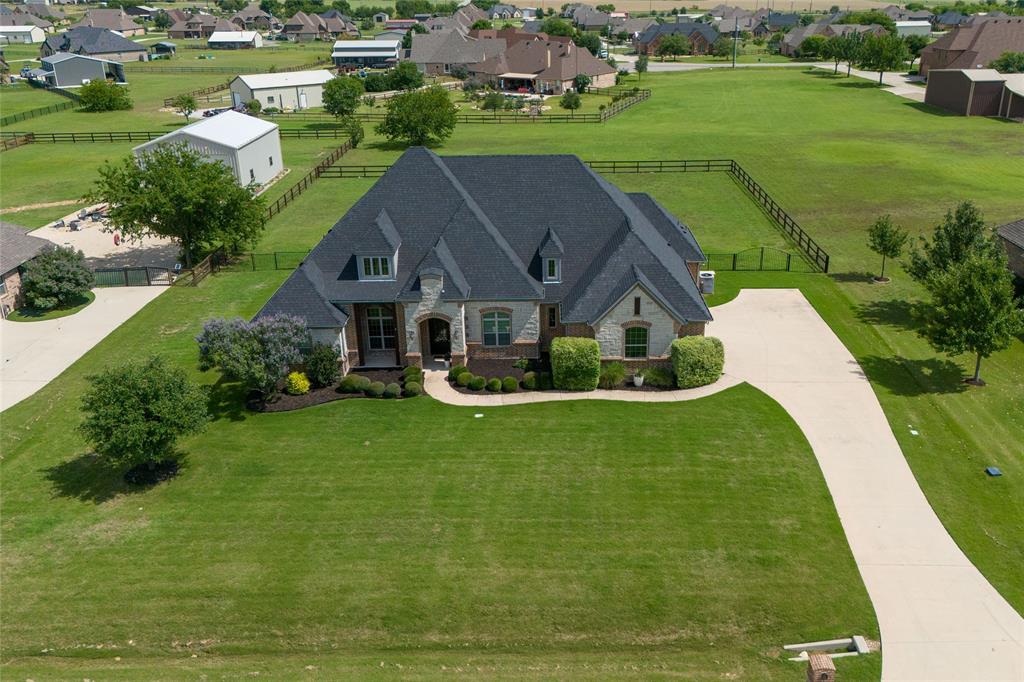 Welcome to this beautifully maintained home nestled on a secluded one-acre lot in the highly sought-after Northwest ISD. Designed with comfort and functionality in mind, this home features a spacious open-concept layout filled with abundant natural light throughout. Elegant hand-scraped hardwood floors add warmth and character, while the large kitchen offers plenty of space for cooking, entertaining, and gathering with family and friends.
Meticulously cared for inside and out, this property combines privacy, style, and everyday convenience. The oversized three-car garage provides ample storage and parking, making it perfect for families, hobbyists, or anyone needing extra space. Enjoy peaceful surroundings with the benefits of top-rated schools and room to relax both indoors and out.