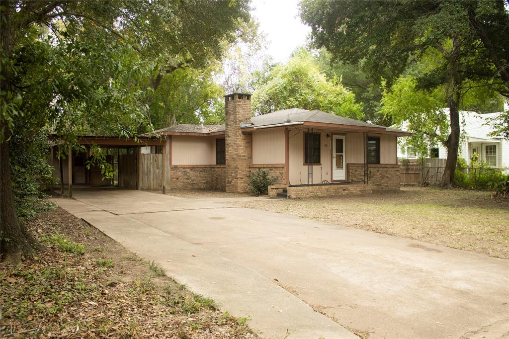 STARTER HOME OR INVESTMENT PROPERTY !! This quaint 2 bed 1 bath home has a lot of charm. The living and dining area is open with a brick fireplace in the center for that cozy feel. Built-in china cabinet adds a nice little touch. Galley style kitchen w white appliances, electric stove, dishwasher and refrigerator. Bedrooms are split with full bath in the middle.  An extra flex room in the back of the house has its own heating and cooing unit. With this space it could be used as a family room or primary bedroom. Privacy wooden fence for your furry friends to roam free. Concrete slab in the backyard is a great spot for a cookout and entertaining. On the side of the house is the carport and attached storage shed. This home is waiting for YOU !! Schedule a showing today !!