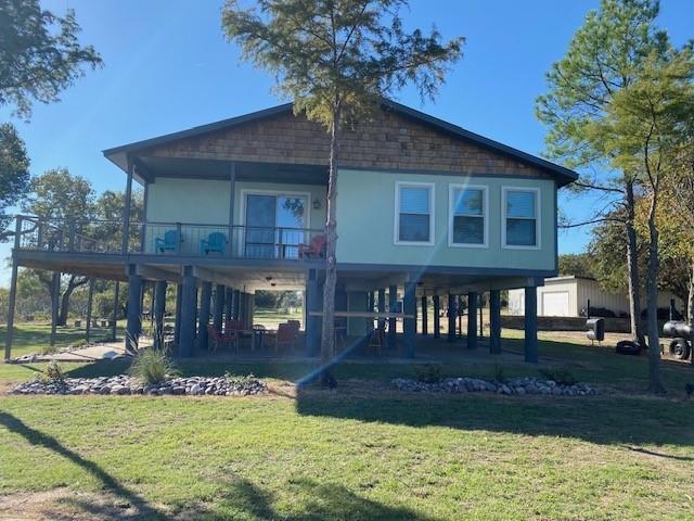 Lakefront options galore!  3 bed 3 bath with dock, boat ramp, hundreds of feet waterfront, 270 degree water views, workshop, boat storage, rv electric hook-up, chicken coop or dog run, & etc storage buildings.  Boat dock has lift, but currently no electric run to the dock.  All of this on enough acreage to let your imagination run wild.  Roping arena? RV spots?  Add cabins?  Divide into 2 or 3 lots?  Turn one of the shops into a bunk house?  Current AirBnB rental, range $225 - $350 nightly or $3k monthly.  Fully furnished and ready to go!  If you're interested in 1031 exchange or need to buy a company rather than real estate, I'd consider selling the holding company containing several lakefront properties. Possible owner finance with large down.