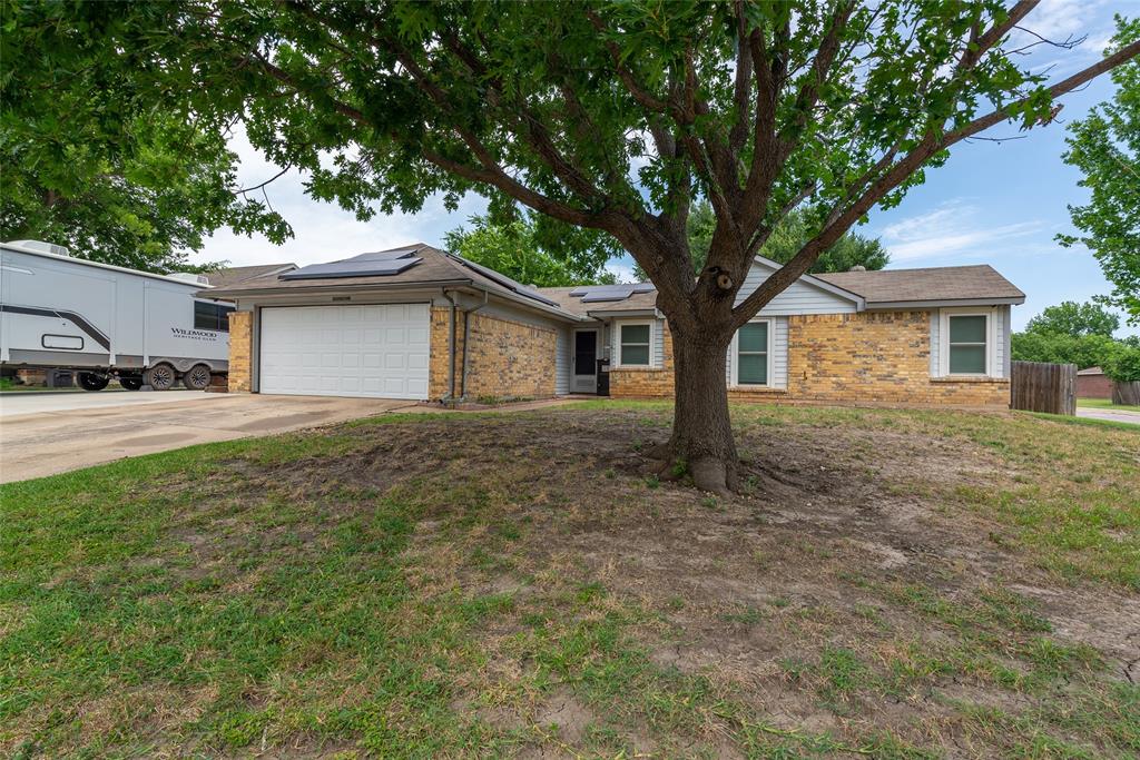 Welcome home to this beautifully maintained 3-bedroom, 2-bath residence located in the highly sought-after Keller ISD. This light-filled home features an open-concept layout with a desirable split-bedroom floor plan, offering both comfort and privacy. The spacious primary suite serves as a relaxing retreat with a large walk-in closet and abundant storage. The inviting living room is centered around a cozy wood-burning fireplace and flows seamlessly into the eat-in kitchen, complete with a large pantry and ample workspace. Recent updates include laminate wood flooring throughout, a new garage door, and a new water heater, providing added value and peace of mind. Step outside to enjoy the covered patio overlooking a generously sized backyard with a pool, perfect for entertaining, relaxing, or enjoying warm Texas evenings. Energy-efficient solar panels help reduce utility costs and enhance sustainability. Conveniently located near shopping, dining, and major highways including Hwy 183 and I-35W, this home offers easy access to everything you need. Whether you're a first-time homebuyer, looking to downsize, or simply searching for a move-in-ready home in a fantastic location, this property is a must-see. Buyer and buyer's agent to verify all measurements, schools, and information contained herein.