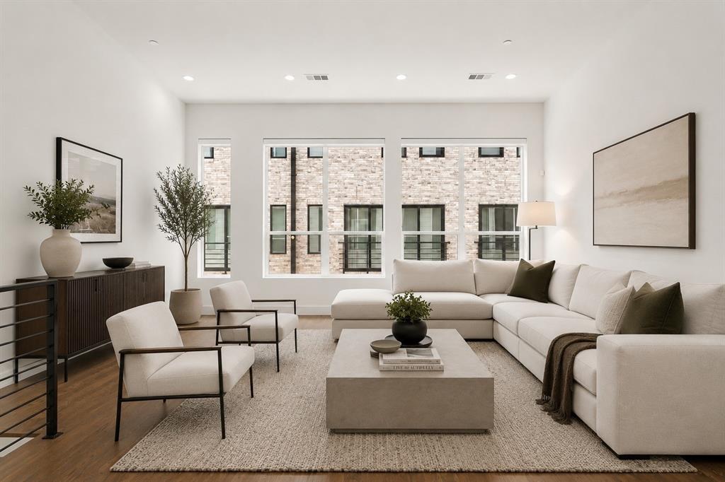 Experience elevated urban living in the heart of Dallas’ vibrant East Village. Built in 2020, this sleek three-story townhome offers the perfect blend of modern design and unbeatable location—tucked away on a quiet street while just moments from Knox Henderson, West Village, Lower Greenville, premier shopping, dining, and the highly anticipated The Central development.

The first floor welcomes you with a versatile flex space—ideal for a home office, workout area, or private retreat. Upstairs, the second level is designed for both entertaining and everyday living, featuring an open-concept layout flooded with natural light from expansive windows. The designer kitchen is a true standout, showcasing Arctic White quartz countertops, an oversized Platinum Gray island, Bosch stainless steel appliances, and custom soft-close cabinetry—all seamlessly flowing into the living and dining spaces.

The third floor is dedicated to rest and relaxation, featuring a spacious primary suite complete with a spa-inspired bathroom and a generous walk-in closet, along with a well-appointed secondary bedroom with its own beautifully finished bath and ample storage.

Thoughtful upgrades throughout include hardwood floors and motorized shades with blackout options in the bedrooms. Enjoy the ease of low-maintenance living with a private fenced front yard—perfect for pets, entertaining, or simply enjoying your own outdoor space in the city.

This is modern Dallas living at its finest—stylish, low-maintenance, and perfectly positioned.