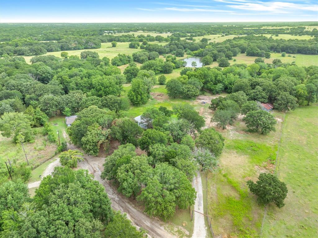 20 Acres, Two 10-Acre Tracts with Pond and Dual Homesites in Wills Point, TX

Rare opportunity to own 20 MOL acres comprised of two separate 10-acre tracts in the highly desirable Wills Point area! Whether you're looking for a private homestead, multi-generational living, investment potential, or the perfect place to build your dream property, this one checks all the boxes.

Nestled among towering mature trees and open pastureland, this beautiful property offers a blend of privacy, usability, and natural beauty. A scenic pond serves as the centerpiece of the land, surrounded by scattered hardwoods, wildlife, and picturesque views in every direction.

The property features an existing 3-bedroom, 2-bath double-wide home with a welcoming covered front porch, providing immediate living accommodations while you build, renovate, or enjoy the land as-is. Even better, a second homesite is already in place with existing electric, water, and on-site sewer where a second manufactured home was recently removed. The infrastructure is ready for another home, guest house, rental property, or family compound.

With two separate tracts, existing utilities at two locations, a pond, mature trees, and multiple build sites, the possibilities are endless. Bring the kids, parents, grandparents, horses, livestock, or simply enjoy the peace and quiet of country living.

Conveniently located just minutes from I-20 and Highway 80, you'll enjoy an easy commute to both Dallas and Tyler while still experiencing the charm and tranquility of East Texas countryside living.

Properties offering this much flexibility, infrastructure, and natural beauty are becoming increasingly difficult to find. Come explore the possibilities and create the legacy property you've been dreaming of.