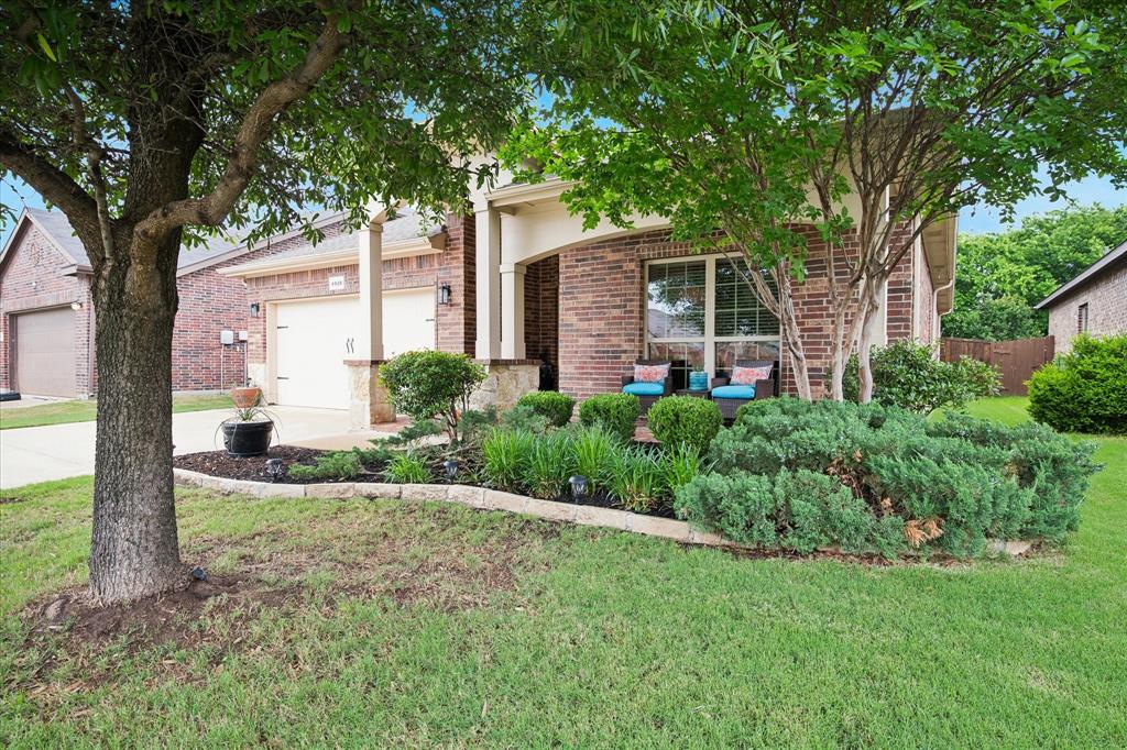 Nestled in the serene back of the Rolling Meadows neighborhood, this immaculate 1,918-square-foot single-story residence offers the perfect balance of peaceful seclusion and prime Keller convenience. Ideally located for an easy commute to the Alliance Corridor or a quick trip to downtown Keller, this home welcomes you with a quiet, private study off the foyer—perfect for the remote professional—followed by two secondary bedrooms. The heart of the home features a light-filled open concept where a chef-ready island kitchen flows effortlessly into a grand living room anchored by a cozy fireplace. Retreat to the primary suite, which boasts views of the backyard and an ensuite complete with a soaking tub, separate shower, and a generous walk-in closet. Outside, the level backyard serves as a  private oasis, bordered by  trees that ensure ultimate tranquility. Residents also enjoy premium community amenities, including a sparkling pool and playground, all within a premier Keller location.
