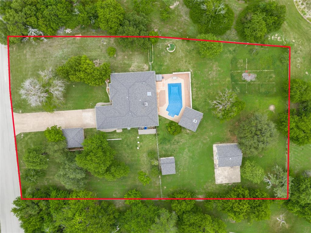 Perfect for that nesting feeling! It’s a comfortable neighborhood, secure brick house with its class 4 roofing, and with meticulous upkeep. You have privacy on over an acre of lightly wooded grounds outside the city limits. Convenience with stores and restaurants only 5 minutes away. Have fun in the pool, cooking in the outdoor kitchen, or sitting by a crackling fire. Fully fenced yard perfect for your kids or pets to run, play, and grow. If you like bird watching, wildflowers, and nature, this is the place for you.