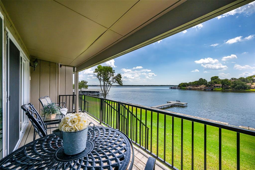 Enjoy lakefront living in this charming 2 bedroom, 1.5 bath condo located in Decordova Bend Estates.  Stunning waterfront views just steps from your backdoor, this is an end unit.  This property offers a perfect blend of comfort and convenience.  Inside, you will find a bright, open layout with electric shades, cozy kitchen, large open concept living area.  Whether you are looking for a weekend getaway, or full time lake living this home is move in ready. Ponte Verde offers private swim dock and boat marina.  (boat slips are extra).  You are within in walking distance of the clubhouse and community pool, pickelball, unlimited golf.