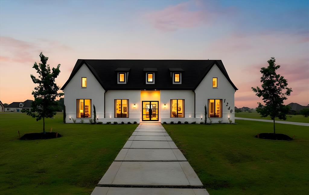 Welcome to the home that truly has it all. Nestled on 1.29 acres in the desirable Shadow Lakes community, this stunning custom-built home offers the perfect combination of luxury, space, and modern comfort. Built in 2022, every detail was thoughtfully designed to create a home that feels both elegant and inviting.

Step inside to soaring ceilings, abundant natural light, and an open-concept layout that was made for gathering. The spacious living area flows seamlessly into the chef-inspired kitchen featuring a large island, extensive cabinetry, and generous prep space—perfect for everything from family dinners to holiday entertaining.

The private primary suite is a true retreat, complete with a spa-like bath, oversized walk-in shower, dual vanities, and a dream closet with custom built-ins. With 5 bedrooms, 4.5 baths, and multiple flexible living spaces, there's room for everyone, whether you need a home office, media room, game room, or guest accommodations.

Outside, you'll find an expansive covered patio overlooking a beautifully sized backyard with endless possibilities. Imagine morning coffee watching the sunrise, weekend barbecues with friends, or creating the backyard oasis you've always wanted.

Located in the Shadow Lakes community, you'll enjoy the peace of country living while remaining conveniently close to shopping, dining, schools, and major commuting routes.