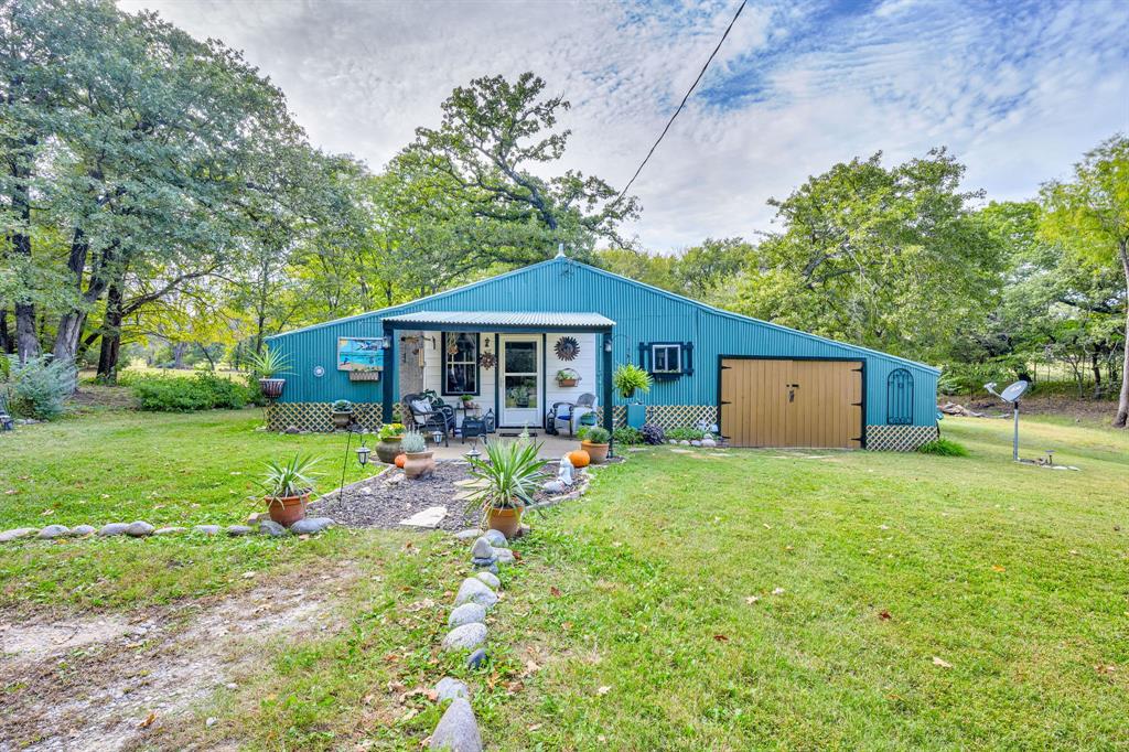 Ready for a new owner, the sellers have checked all the boxes to be sure this home is move-in ready. From fresh paint roof to floor inside and out to updating some plumbing and electrical as well as AC maintenance , all you need is the key to this piece of paradise. A unique property offering more than just a home; it's a lifestyle! Whether you’re dreaming of a homestead or an artist’s studio, the possibilities are endless. Tucked beneath mature oak trees, this gem is bursting with character and charm. From vibrant garden beds to cozy outdoor seating, every corner of this property tells a story. Enjoy ample room for family gatherings or cozy nights in. Enjoy the walking trail around the private acreage.The interior open layout allows for natural light to fill the space, creating a warm and welcoming atmosphere while all the windows and doors bring a bit of outside in.  Whether you're looking for a peaceful retreat or a place to entertain, this home provides endless possibilities. Nestled in a serene neighborhood, you're just a stone's throw away from local amenities while enjoying the tranquility of country living. Don't miss your chance to own this incredible home! Schedule a tour today.