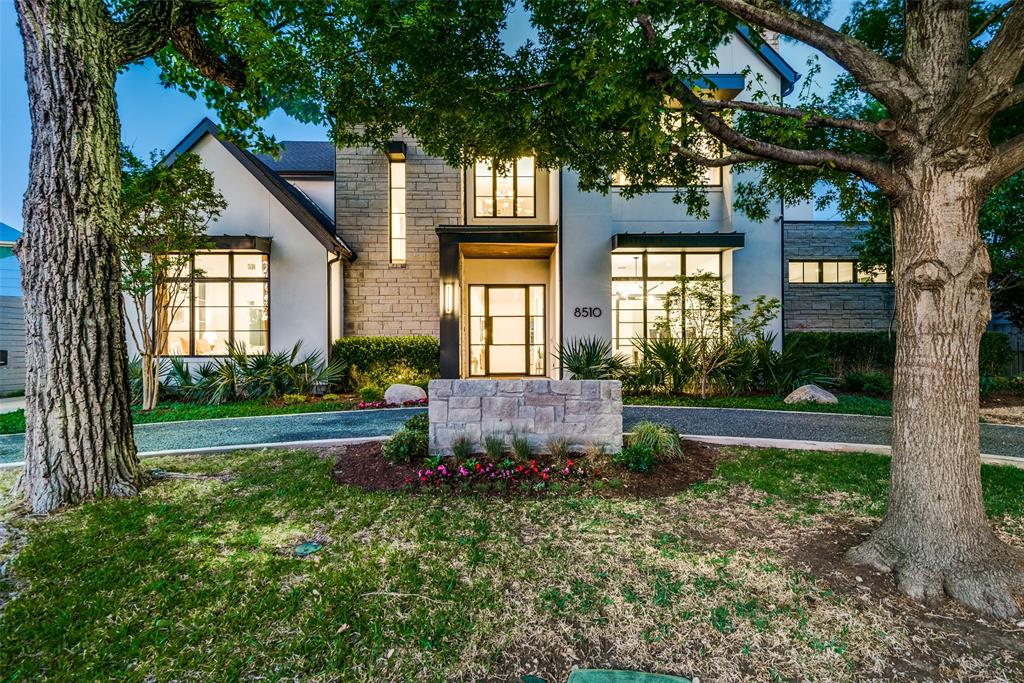 (Agents: THIS IS NOT LOCATED ON BUSY MIDWAY ROAD.  Please map it) This luxurious resort-style living situated in the highly sought-after Bluffview Estates neighborhood in Dallas is truly remarkable. Built in 2019, the main house offers 5 bedrooms with opulent en-suite baths, 4 living areas, 2 dining spaces, 2 powder baths, a fantastic bar for entertaining, and a glassed-in wine room. The detached guest quarters or office space boasts a full bath, a pool bath, a covered patio, and a second floor covered balcony. 
The backyard is a stunning oasis with a heated pool, spa, turf yard, built-in grill, exterior speakers, oversized 3+ car garage, and a large covered patio with a fireplace. The interior is equally impressive, featuring clean lines, soaring ceilings, hardwood floors, Wolf-Thermador-Asko appliances, whole home generator, stone waterfall-edge island, gas fireplace, mosaic tile baths, and Lutron lighting are just a few of the many highlights. Additional 560 sqft detached quarters.