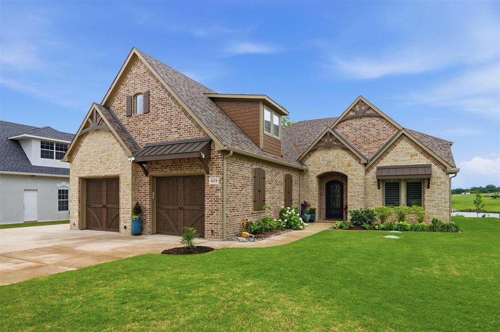 Welcome to refined lakeside living in the prestigious gated community of Lake Kiowa—where luxury, comfort, and recreation come together seamlessly. This exceptional 4-bedroom, 4.5-bathroom home with a dedicated bunk room and spacious bonus room is thoughtfully designed for both everyday living and unforgettable entertaining. Step inside to discover 10-foot ceilings throughout, complemented by rich white oak solid hardwood floors and striking wood beams that accentuate the cathedral-vaulted living room. At the heart of the home, a one-of-a-kind stone, wood-burning fireplace creates a warm and inviting focal point, while expansive windows invite in natural light and serene lake views. The chef’s kitchen is a true centerpiece, featuring a stunning, expansive quartzite island paired with premium Wolf appliances—perfectly blending elegance and performance. Quartzite surfaces continue throughout every bathroom, offering a cohesive, high-end finish across the home. The thoughtfully designed bunk room is a standout, complete with four built-in bunks and additional space to play, making it ideal for hosting family and guests. An expansive laundry room adds incredible versatility, doubling as a functional office and sewing room to suit a variety of lifestyle needs. Built with 2x6 construction, this residence provides enhanced efficiency and durability, along with tankless water heater, full-house water filtration system, and reverse osmosis system. Seamlessly blending indoor and outdoor living, the electric screened porch overlooks the lake and features a fully equipped outdoor kitchen- ideal for year-round entertaining. Plantation shutters throughout add timeless style and privacy. Perfectly positioned within the community, this home offers convenient proximity to The Lodge, West Beach, and Little Wolf Park, making it easy to enjoy dining, recreation, and outdoor fun just moments from your doorstep. Experience lake living at its finest.
