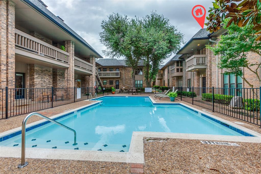 PRICE REDUCTION! Experience a carefree lock and leave lifestyle at the prestigious gated 5800 Royal Lane Condominiums! This fantastic second floor unit with higher ceilings was totally renovated in 2020 -no surface left untouched! Elegant architectural details include 6 inch baseboards, double crown molding, door and window trim and plantation shutters. Windows and doors were all replaced along with hardwood, marble tile floors and fresh carpet. The cheerful kitchen was totally renovated with sleek granite countertops, SS appliances, a built-in pantry and coffee bar. The cohesive design continues through the bathrooms which feature contemporary yet classic finishes and chrome fixtures. Plumbing and electrical was all redone with recessed lighting, ceiling fans and light fixtures throughout. Primary bedroom has two closets including a huge walk-in closet. The spacious secondary bedroom includes two closets. One covered carport parking space close by and additional parking available. Overlooking one of 4 pools and nestled amongst towering trees, the setting is absolutely serene in the midst of the hustle and bustle of North Dallas. Responsive on-site HOA management! Affordable dues include all utilities, Wifi, streaming service, blanket insurance, structure maintenance, etc.  Refrigerator, washer and dryer convey. Conveniently located near upscale Preston Royal with great dining, shopping and Central Market, everything you need is just minutes away.