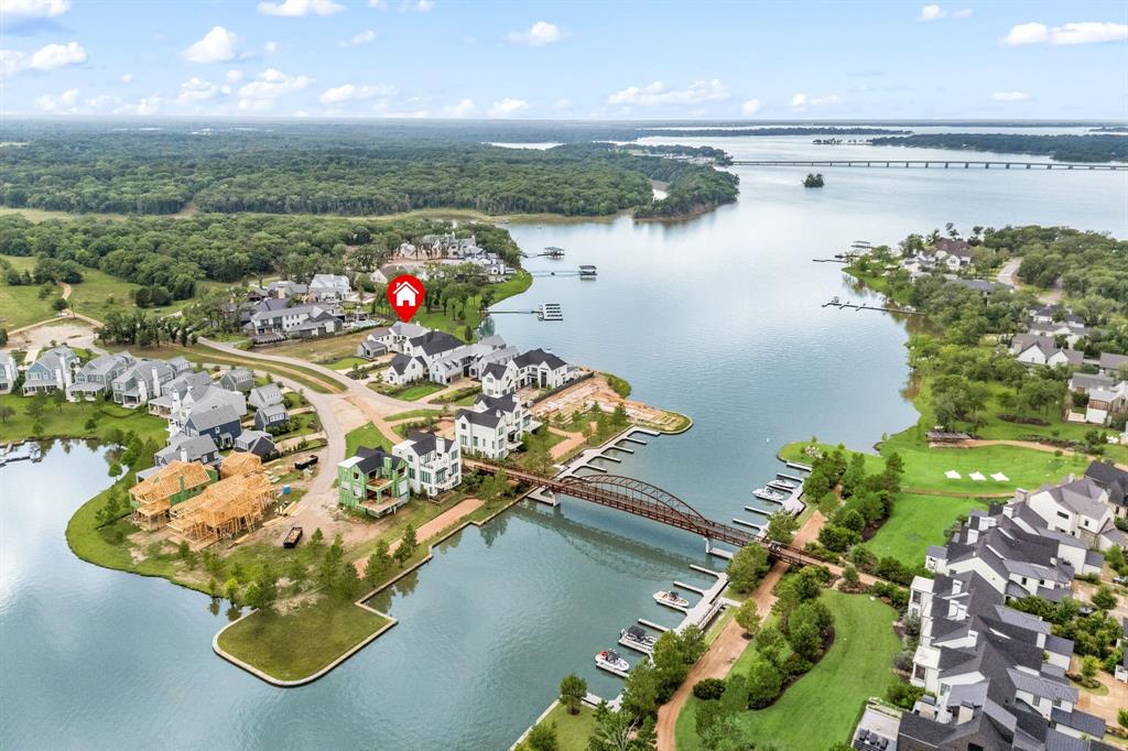 Just over an hour from Dallas, this stunning five-bedroom lakefront retreat in the exclusive Long Cove community offers the ultimate in lakeside luxury.
Perched on the deep, clear end of Cedar Creek Lake, this home combines elegant design with everyday comfort—featuring high-end finishes, expansive lake views, and an open-concept layout ideal for effortless entertaining.
Set within a premier 1,200-acre master-planned community, Long Cove redefines lake living with eight and a half miles of pristine shoreline and an unmatched lineup of resort-style amenities. Residents enjoy access to a bayside infinity pool, adventure park, amphitheater, fitness studio, Lake Club, and Regatta Grill. Sports enthusiasts can take advantage of pickleball, tennis, and basketball courts, a 9-hole golf course, driving range, and even a helipad for convenient travel.
The community is built for outdoor fun and family connection, offering everything from a bike hut and wooded trails to Bluegill Pond, beach volleyball, bocce ball, white sand beaches, and multiple swim coves. Whether you're relaxing fireside with panoramic lake views or spending the day exploring the water, this home is your gateway to an elevated lifestyle.
Ownership comes with full access to resort amenities, including boat valet, docks, and a calendar of curated events, making second-home ownership stress-free and rewarding.
With curated experiences like live music, chef-driven dining, and a strong sense of community, Long Cove turns weekends into lasting memories—and neighbors into lifelong friends.