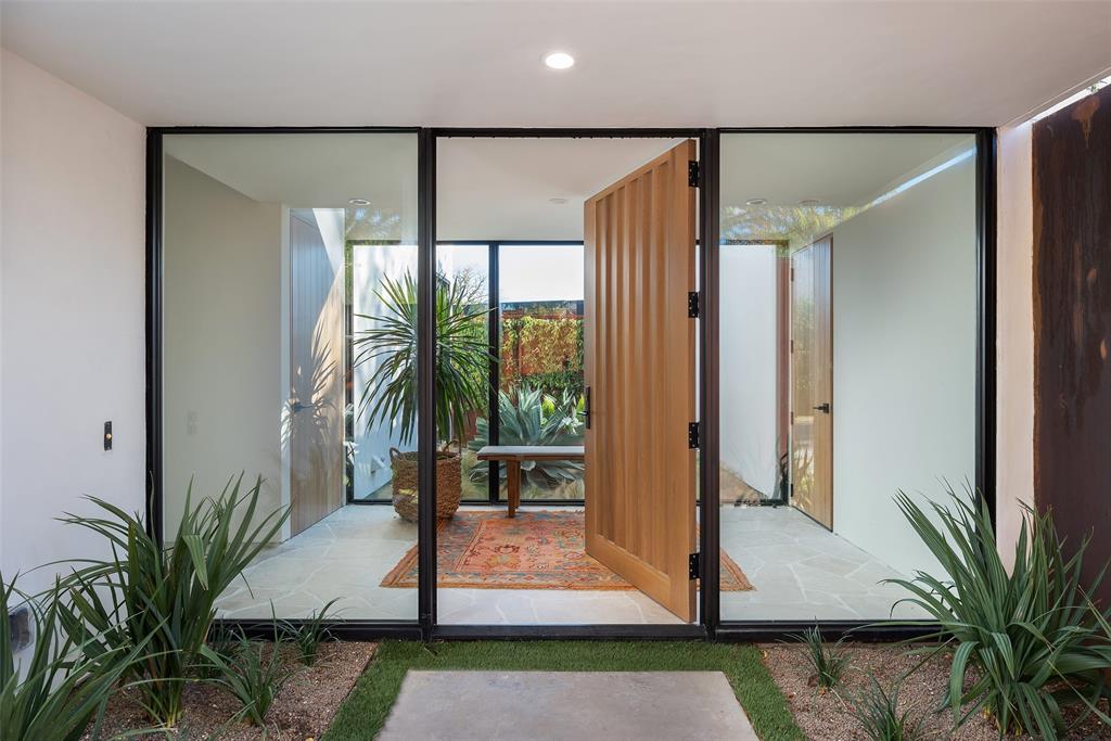 This stunning 3235 sqft California modern home, meticulously designed by architect Paul Field, seamlessly blends elegance and functionality. The primary suite, located on the first level, offers breathtaking views of the private pool and spa, creating a serene oasis. The recent refurbishment includes the kitchen, primary bathroom and closet, new stucco, new garage, new air ducts, vents, and HVAC, lighting and so much more. All of this elevates the home’s aesthetic. Surrounded by a high Corten steel wall, the property exudes exclusivity and security. Its ambiance echoes the chic allure of Palm Springs, infusing the vibrant essence of California into the heart of Dallas.