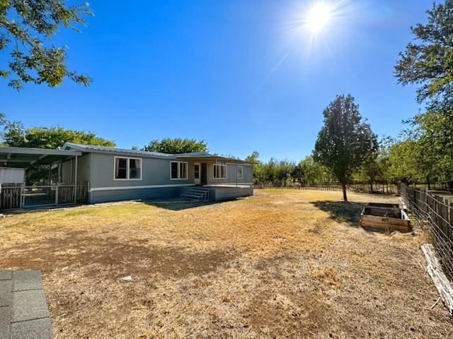 MOTIVATED SELLER IS OFFERING $5,000 TO HELP BUYER WITH CLOSING COSTS OR A 2-1 BUYDOWN! 
This spacious 4 bed, 2 bath home sits on approximately 4.01 acres tucked away in the heart of Graford, fully secluded for peaceful country living. The property is just a short drive to Possum Kingdom Lake for outdoor adventures! You will love the inviting, open floor plan living room and kitchen, and big bedrooms filled with lots of light. The fully covered back porch is perfect for barbeques or sitting outside with a cup of coffee! The 4 acres is fenced and cross-fenced, ready for your animals! The property also includes an RV carport, metal storage shed, and a large 30x30 shop, fully insulated with double sliding doors, electric and plumbing in place, with a tornado shelter and hydraulic lift! Come enjoy country living today!